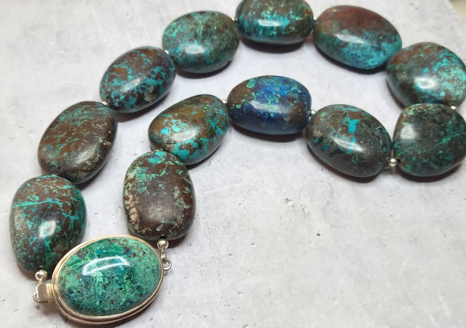 The length of the necklace is 18 inches (45.7 cm). The size of the beads varies from 32 to 36 mm.
Amazing genuine chrysocolla from Arizona Copper Mine, not treated in any way. The beautiful smooth matte finish on these rare large-high-quality beads.