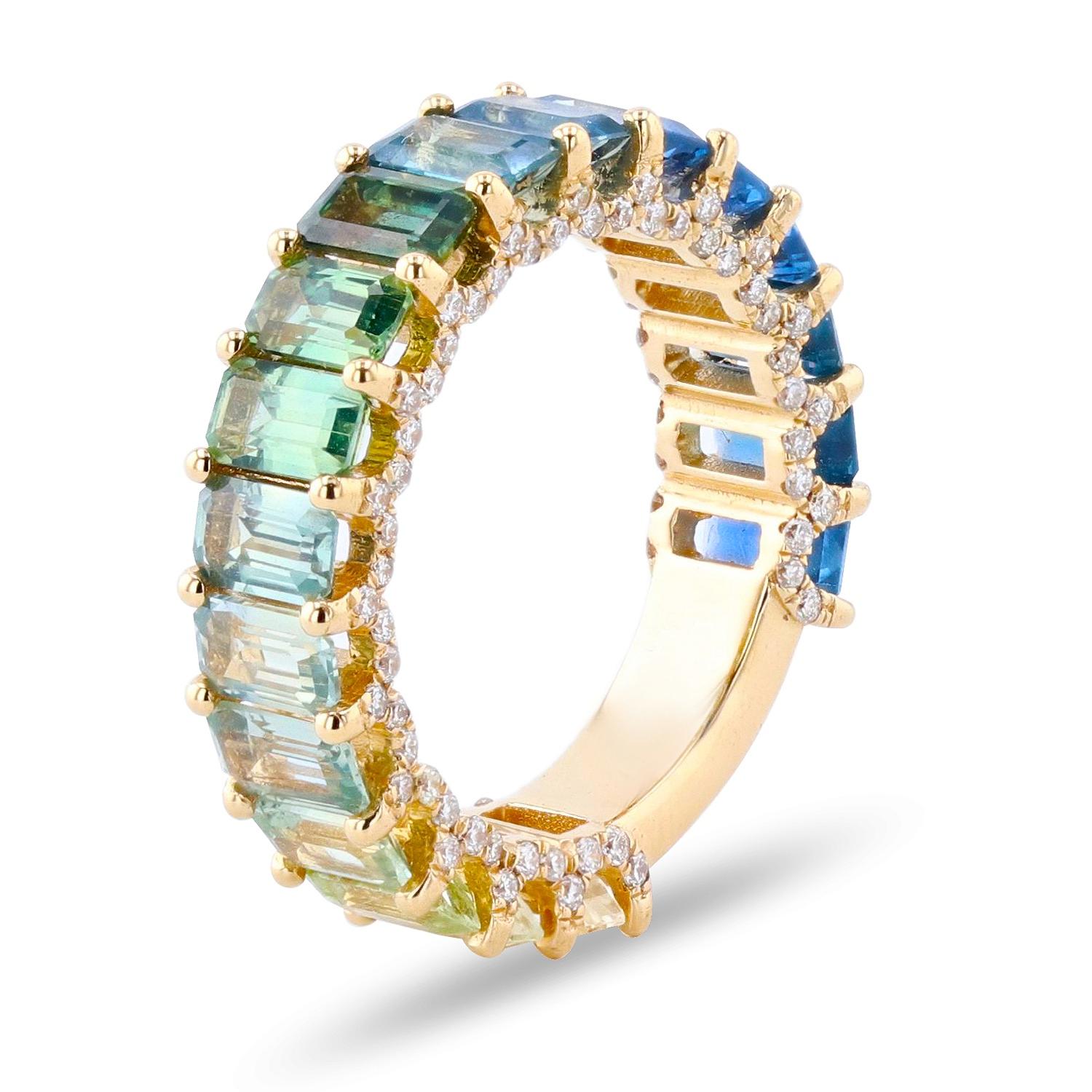DETAILS:
- 6.22 carats of hand selected green to blue sapphires 
- .56 carats of round diamonds U- shape diamond wall detail along the sides of the band. 

Size 6.5 but can be sized one full size up or down.