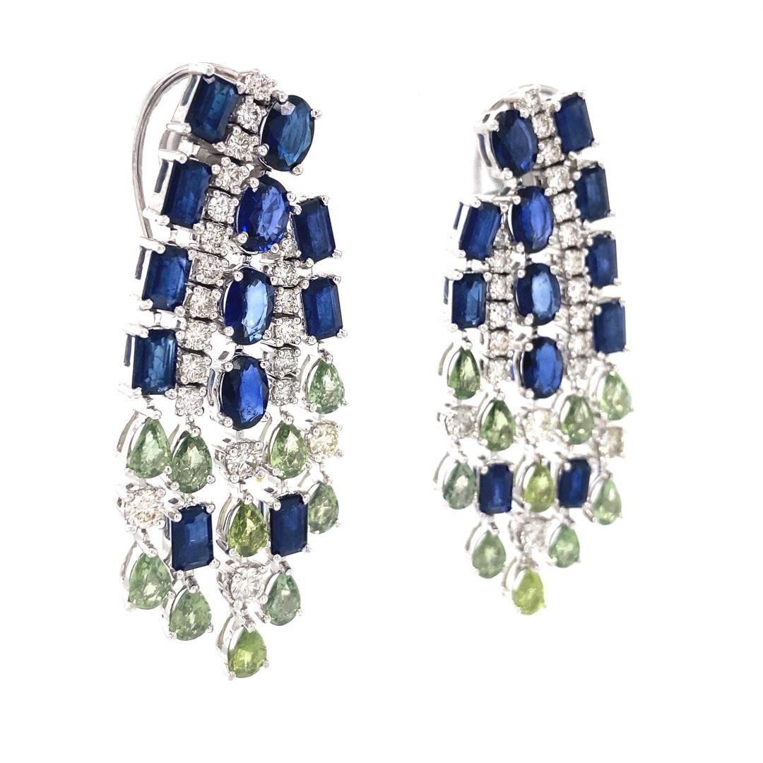 
Elevate your style with these luxurious blue and green sapphire diamond earrings, expertly crafted to dazzle. These breathtaking earrings feature an array of brilliant blue sapphires and vibrant green sapphires, elegantly accented by sparkling