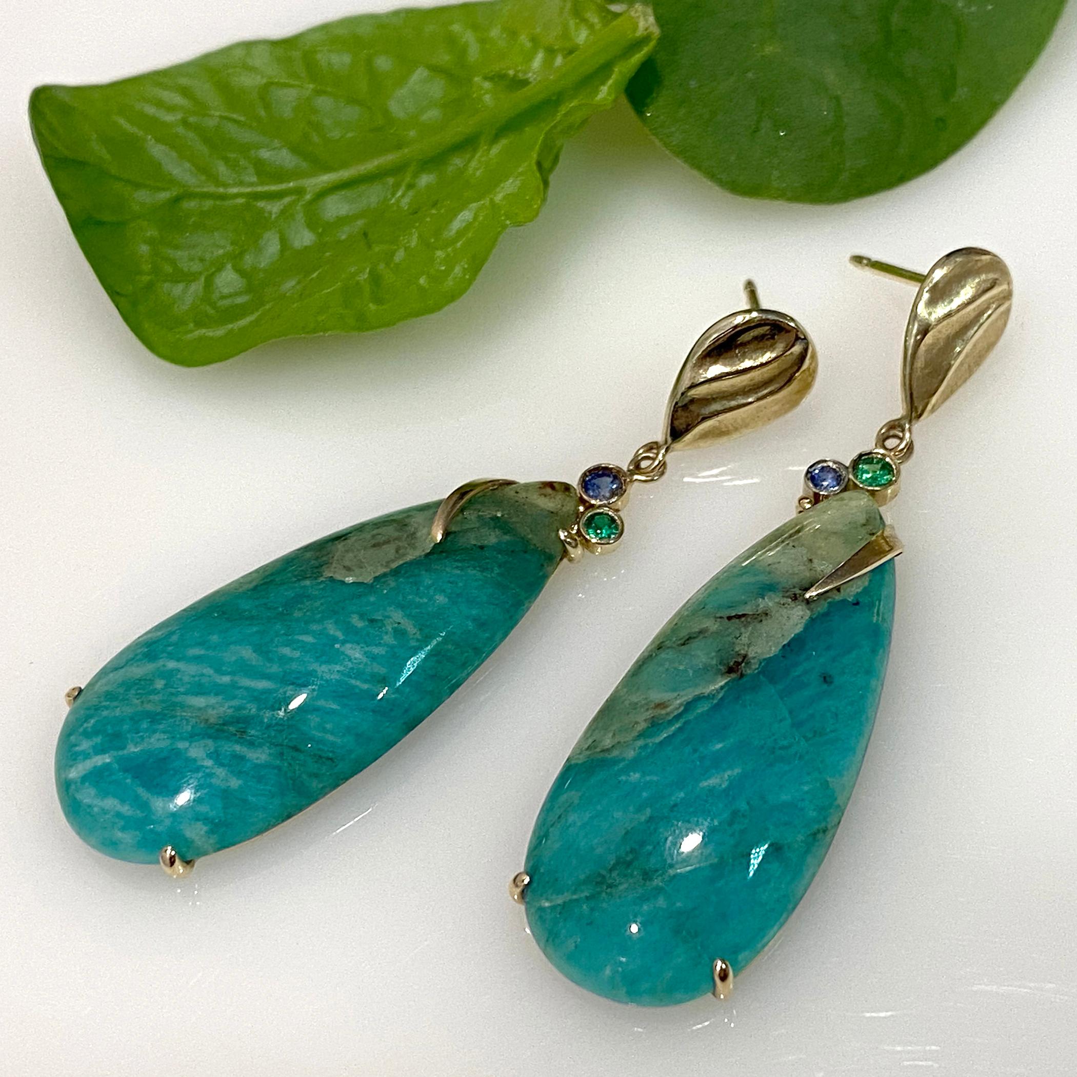 Keiko Mita's contemporary Lagos Earrings, which are handmade from 14 Karat Yellow Gold, feature 37.2 carats (total) natural color Amazonite (no treatment) accented with 0.10 carats (total) Blue Sapphire and 0.09 carats (total) Green Garnet set in 14