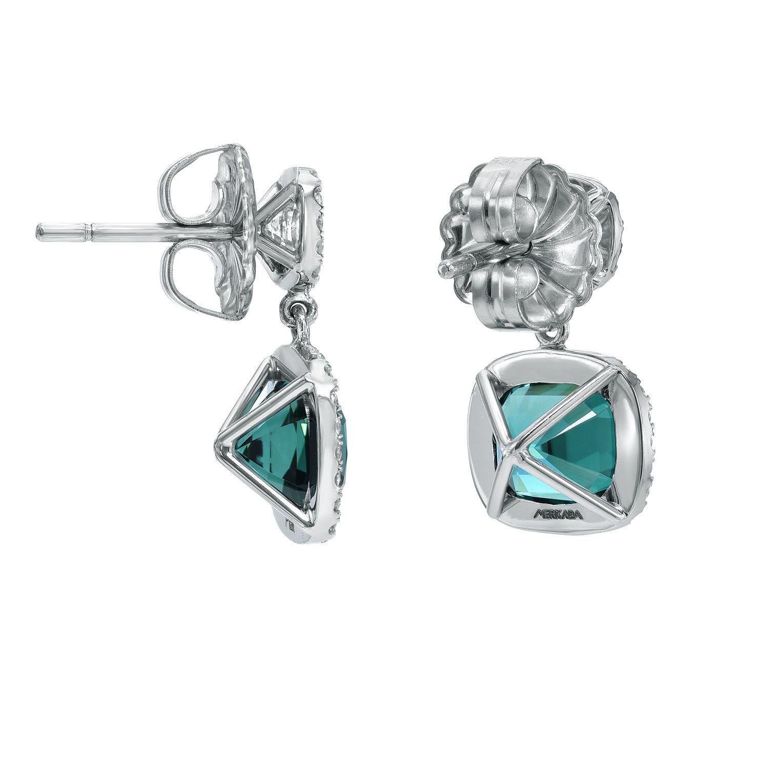 Exquisite platinum earrings, set with an exotic and desirable 4.61 carat pair of 