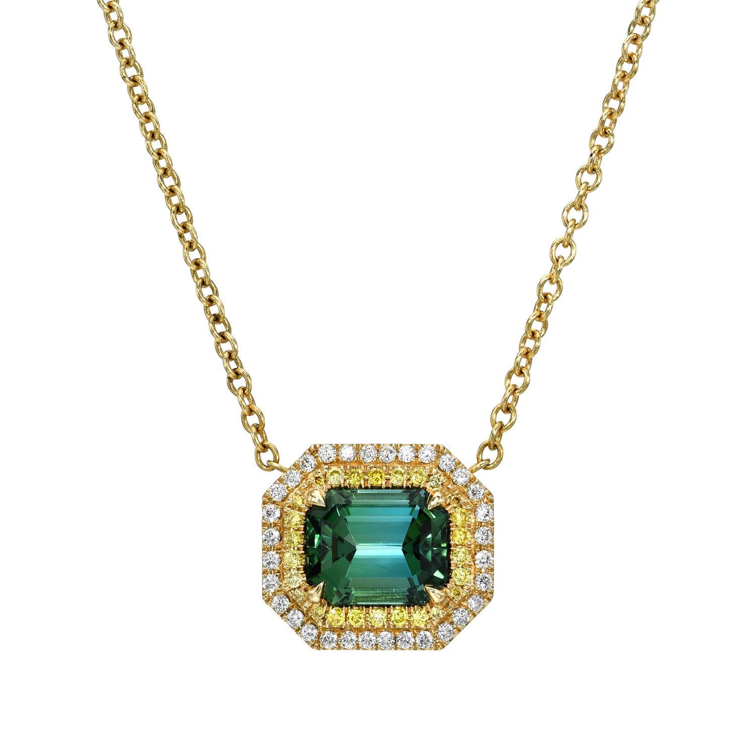 18K yellow gold necklace set with a 3.38 carat Blue-Green Tourmaline emerald-cut, decorated with a double halo set with a total of 0.18 carat fancy intense yellow diamonds, VS-SI1, and a total of 0.24 carat F-G/VS round brilliant diamonds.

Returns