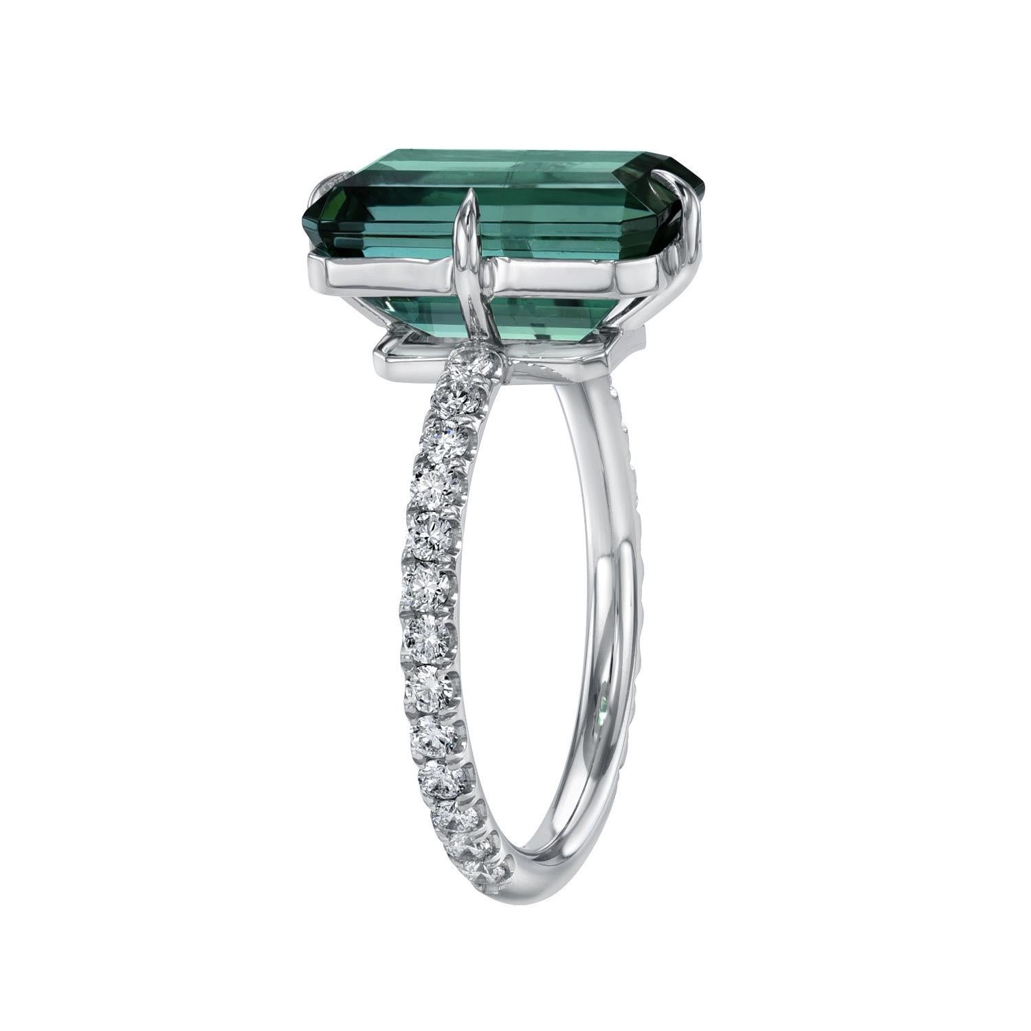 Unique 4.75 carat Bluish-Green Tourmaline elongated emerald-cut platinum ring, decorated with round brilliant collection diamonds totaling 0.44 carats.
Ring size 6. Resizing is complementary upon request.
Crafted by extremely skilled hands in the