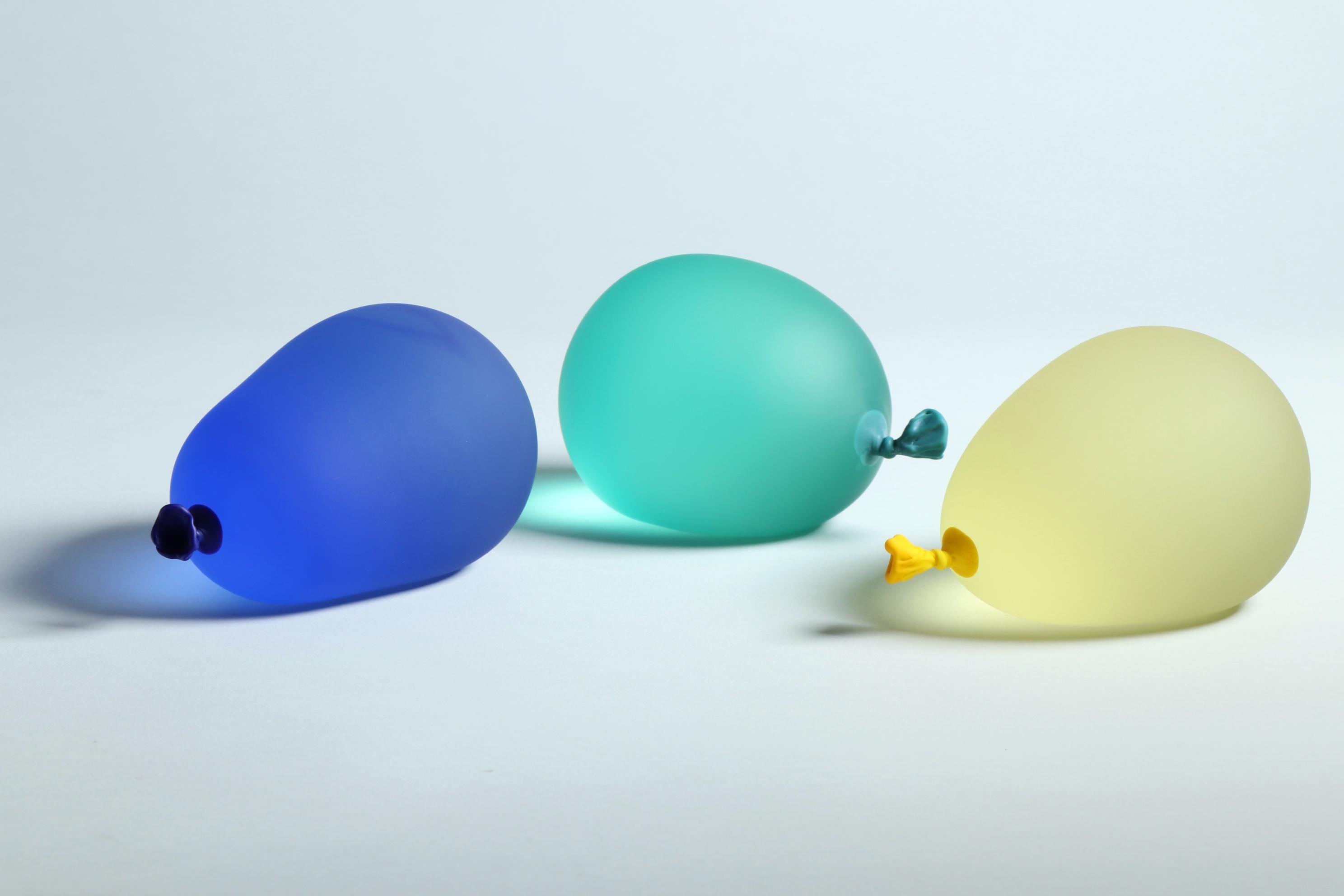 Dylan Martinez’s hyperrealistic water balloons are made of solid sculpted glass sandblasted and acid-etched to resemble real water balloons. The sculptures are made in small batches, and each color is hand-mixed. Each piece is unique and is signed