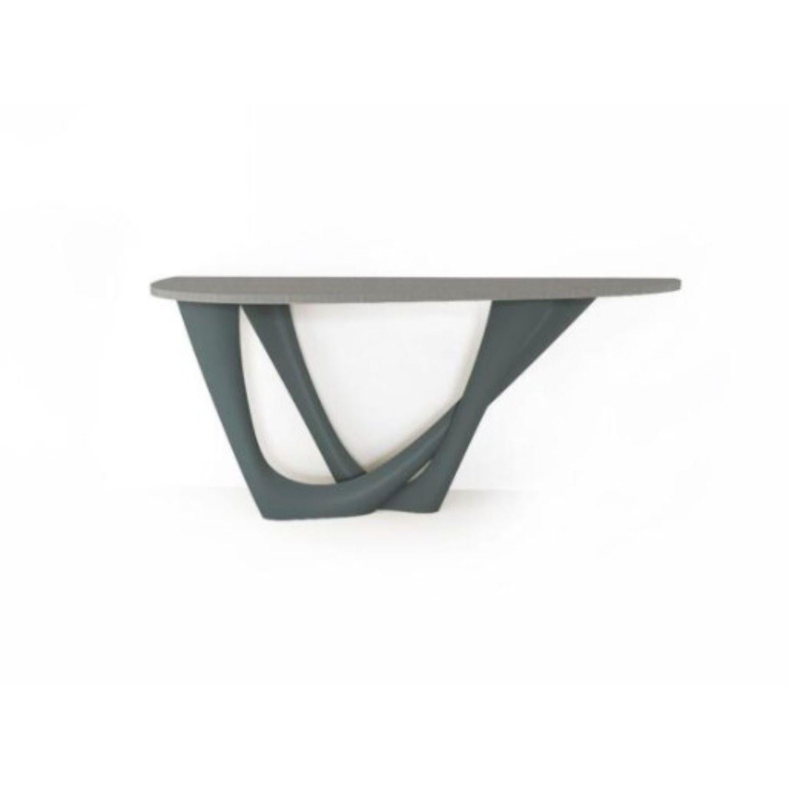 Blue Grey G-Console Duo concrete top and steel base by Zieta
Dimensions: D 56 x W 168 x H 75 cm 
Material: Carbon steel, concrete.
Also available in different colors and dimensions.

G-Console is another bionic object in our collection. Created for