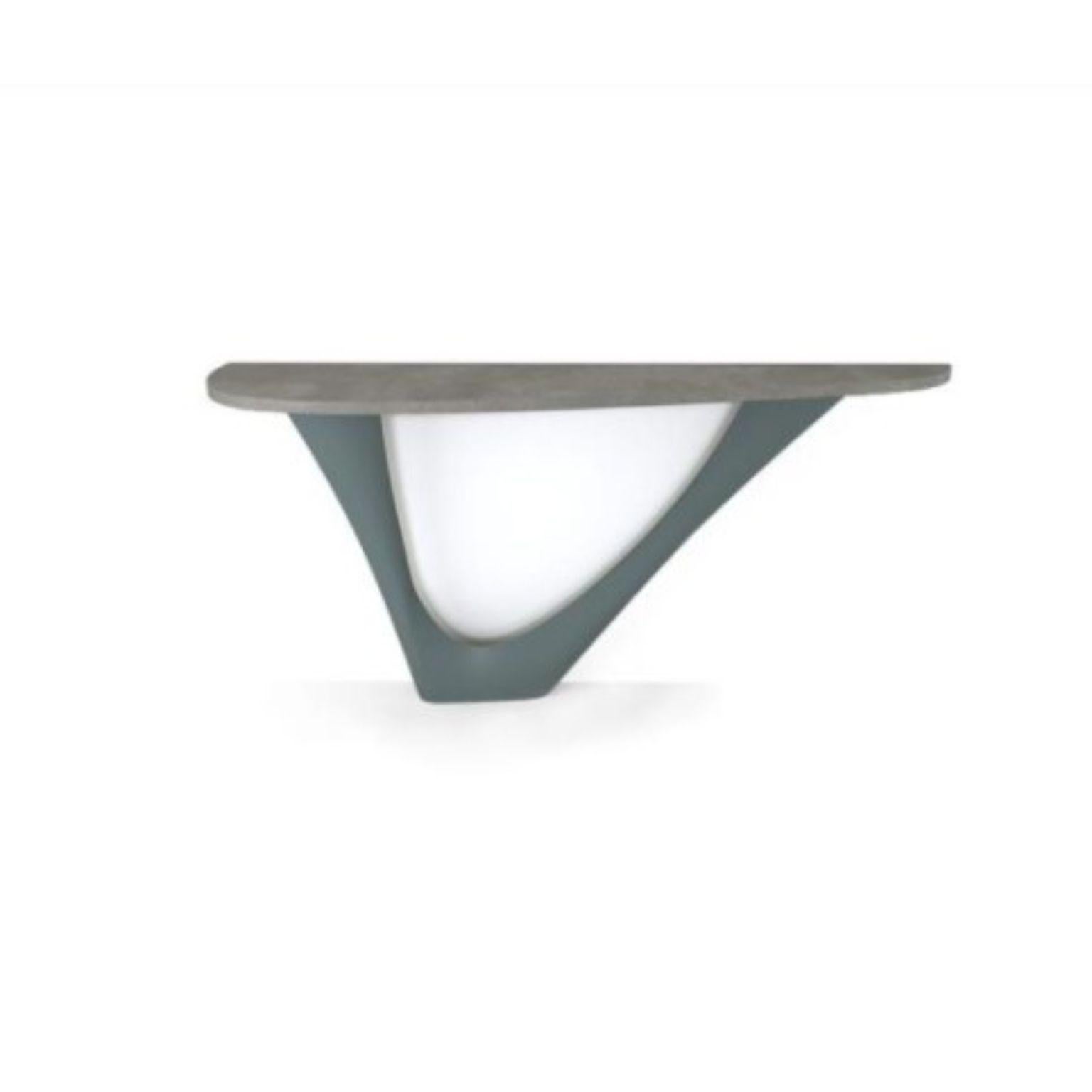 Blue grey G-console mono steel base with concrete top by Zieta
Dimensions: D 43 x W 159 x H 75 cm.
Material: concrete, carbon steel.
Also available in different colors and dimensions.

G-Console is another bionic object in our collection. Created