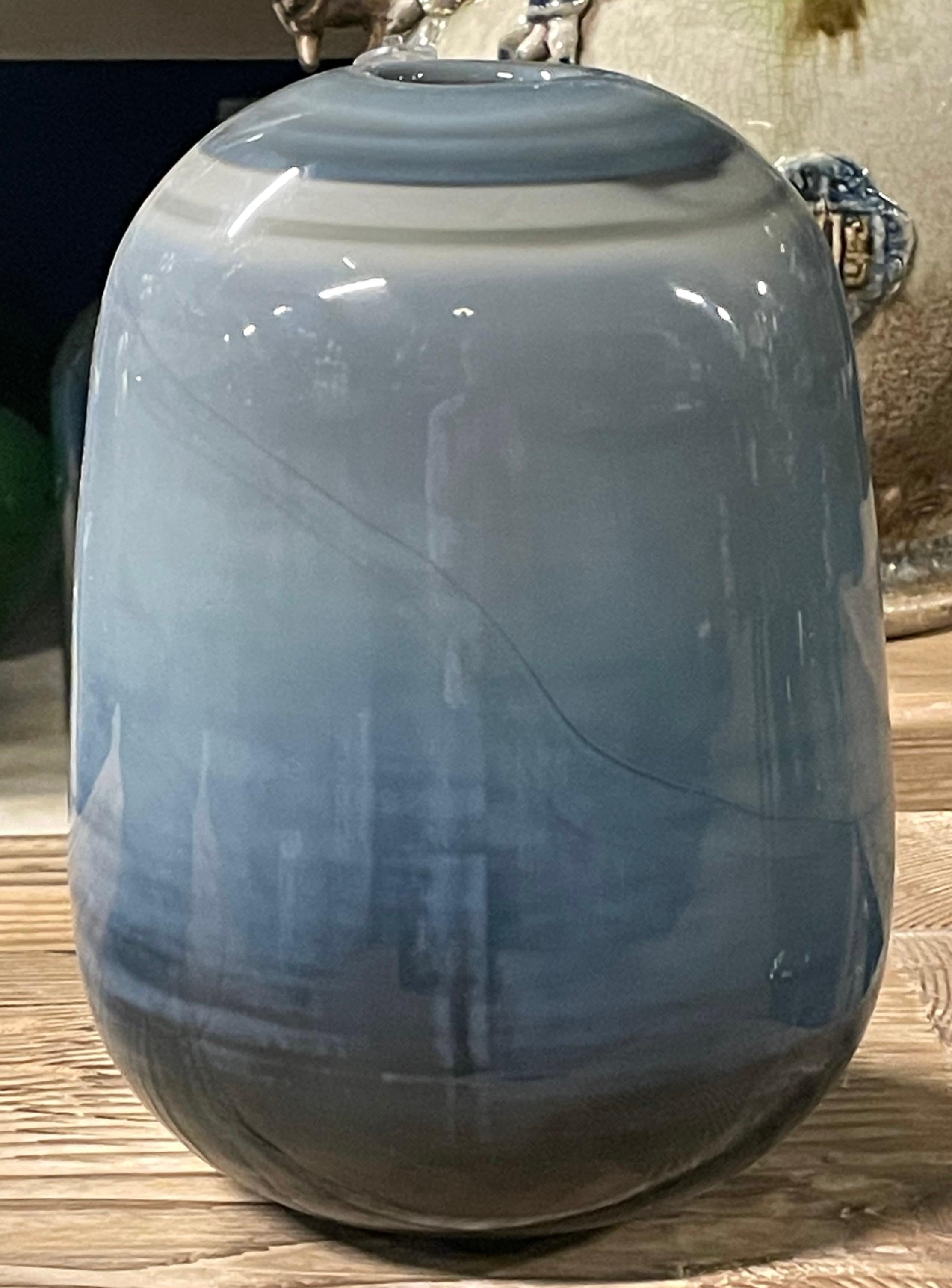 Contemporary Romanian glass vase with blue/grey ombre colorway.
Two available and sold individually.
Can hold water.
