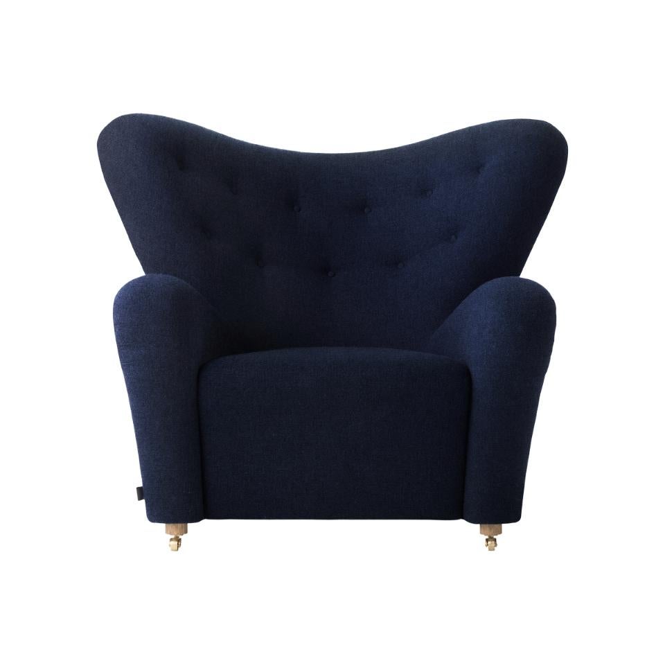 Blue hallingdal the tired man lounge chair by Lassen.
Dimensions: W 102 x D 87 x H 88 cm 
Materials: Sheepskin.

Flemming Lassen designed the overstuffed easy chair, the tired man, for the Copenhagen Cabinetmakers’ guild competition in 1935. It