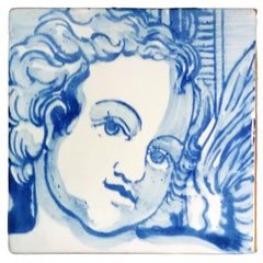 Mattonella di ceramica portoghese blu dipinta a mano con cherubino o angelo o Azulejo