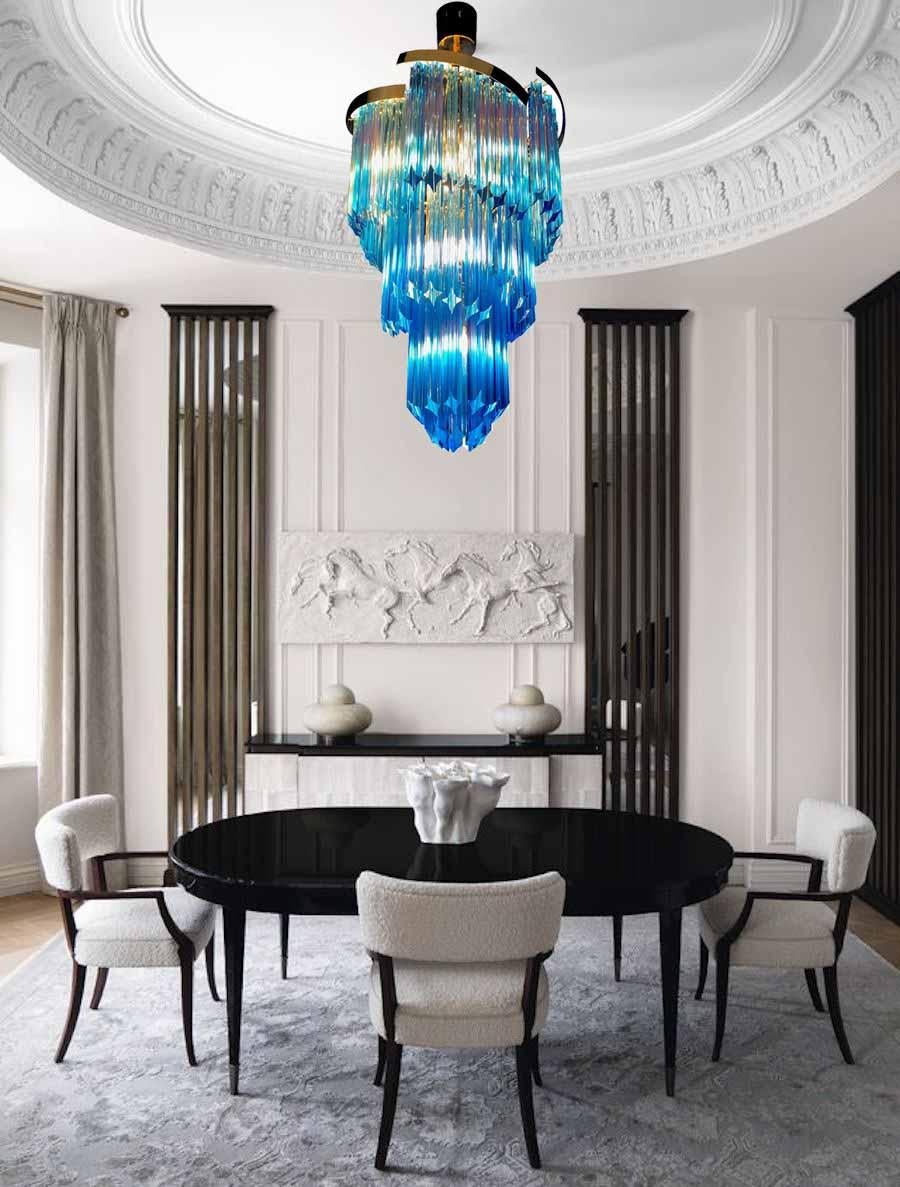 Blue heavenly Murano chandelier made by Quadriedri crystal prism with a golden metal frame.
Period: circa 2000
E 14 lamp holders suitable for the American electrical system.
Perfect condition and fully working.
Available also a pair.
