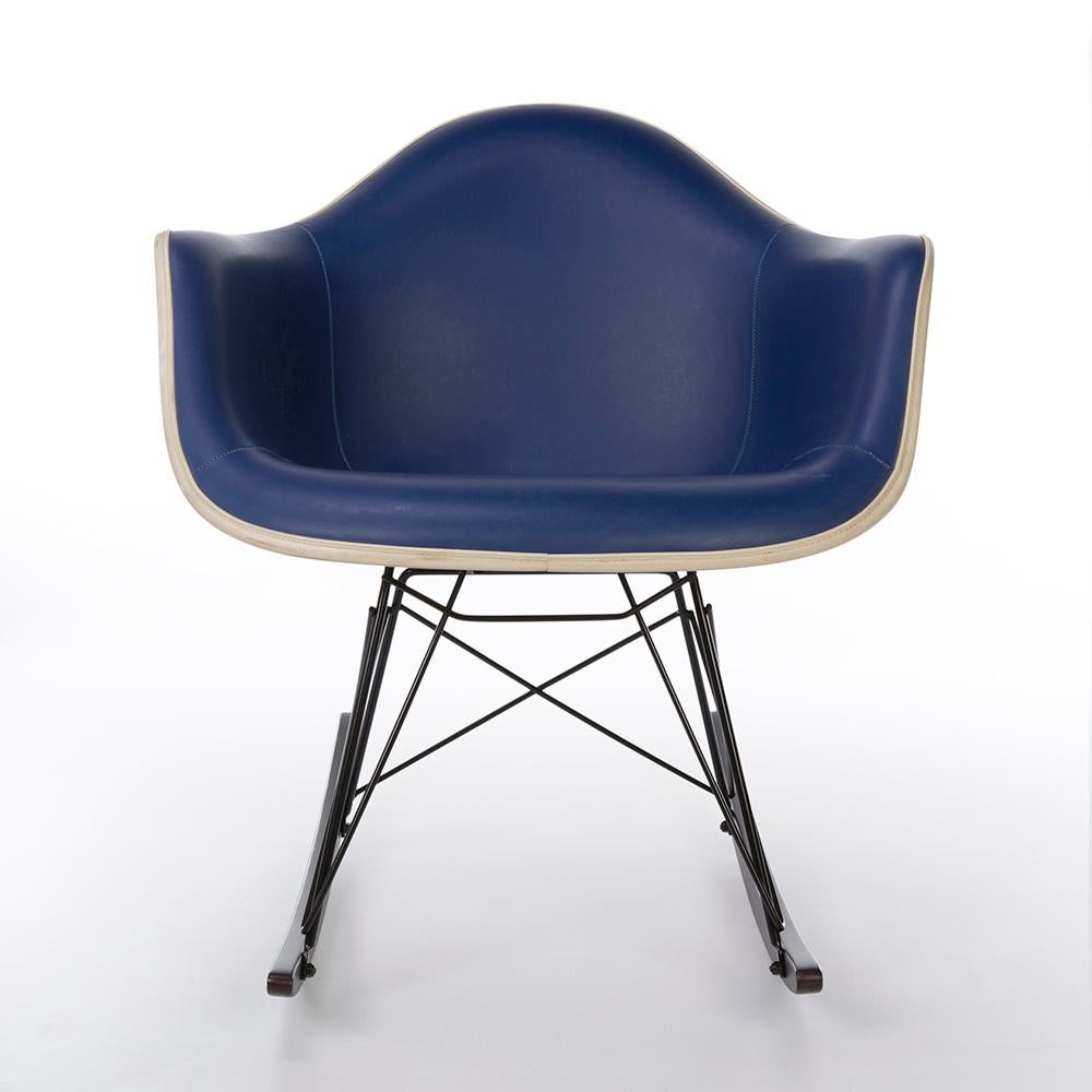 A Herman Miller vintage, original, Eames blue vinyl upholstered white arm shell chair on its new RAR base is a great addition to any home, office or collection. Varies slightly from the picture, the RAR base is brand new with the rocking base of