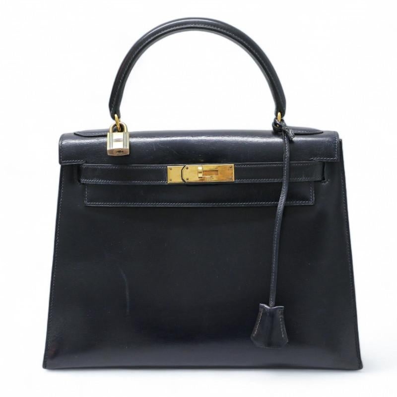 Amazing vintage HERMES Kelly 28 black Sellier bag

Condition: good
Made in France
Model: Kelly 28 sellier
Material: box leather
Interior: smooth leather
Color: navy blue
Dimensions: 28 x 21 x 11 cm
Letter: E in a circle
Year: 1975
Hardware: gilded