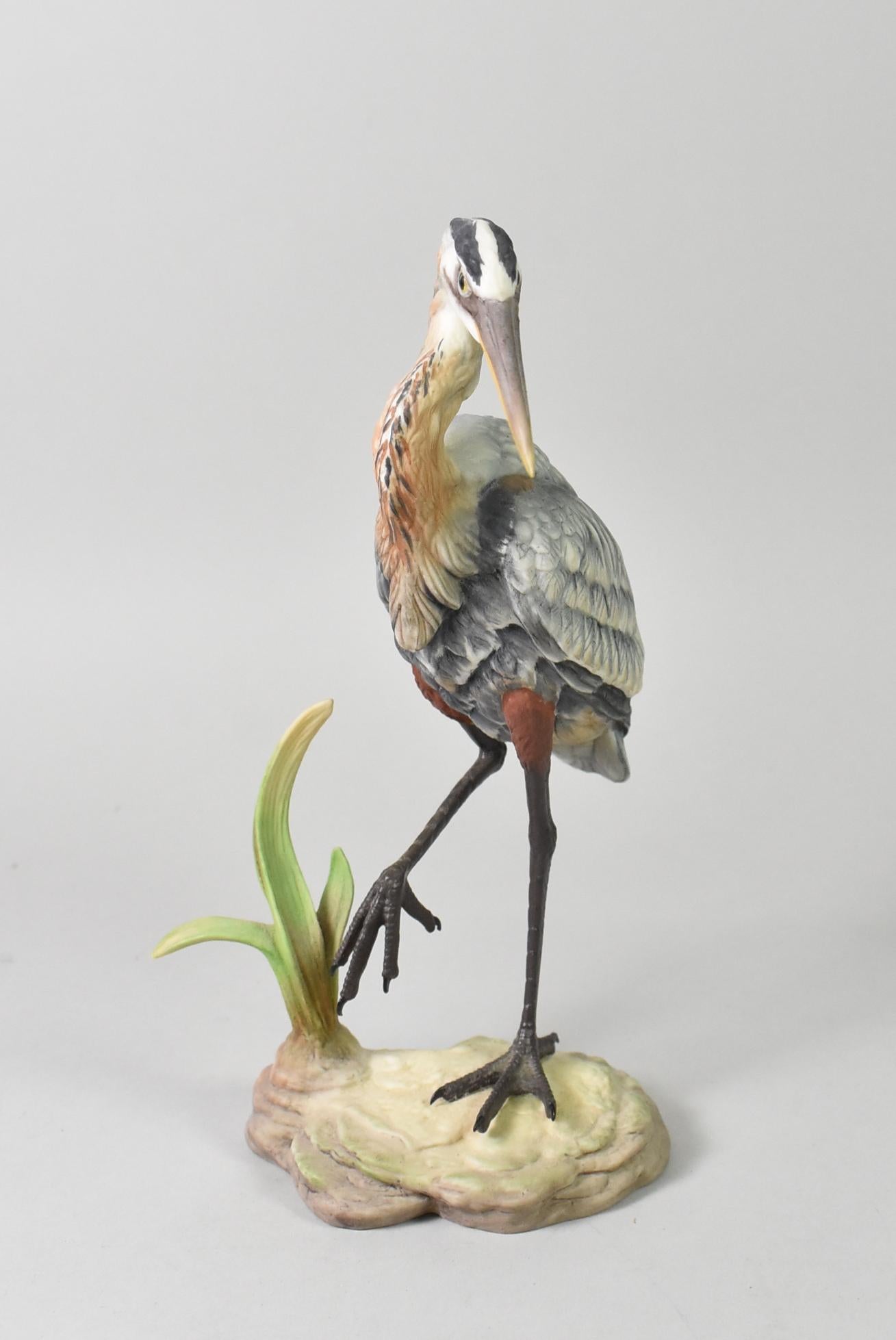 Boehm blue heron figurine. Standing with foot raised. Made in the USA and part of the Wading Bird Series. 8.25