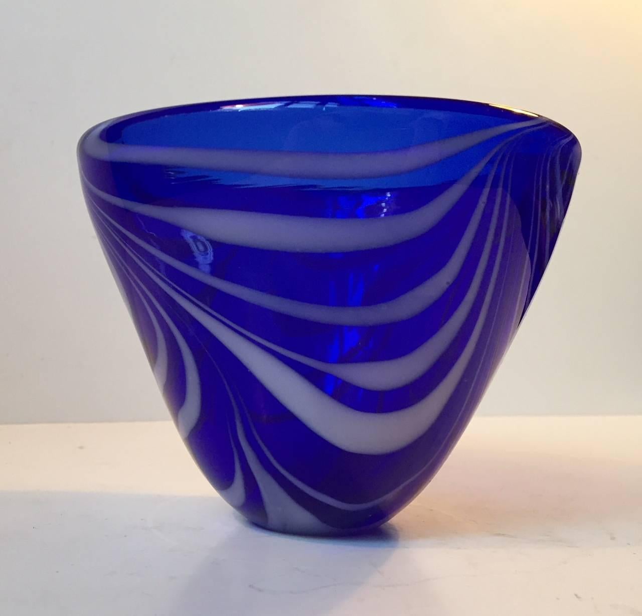 Thick cobalt blue conical glass bowl with white spiral/swirl decor og opaque glass. Manufactured by Holmegaard and designed by Torben Jørgensen in Denmark during the 1980s in a style reminiscent of Vicke Lindstrand.