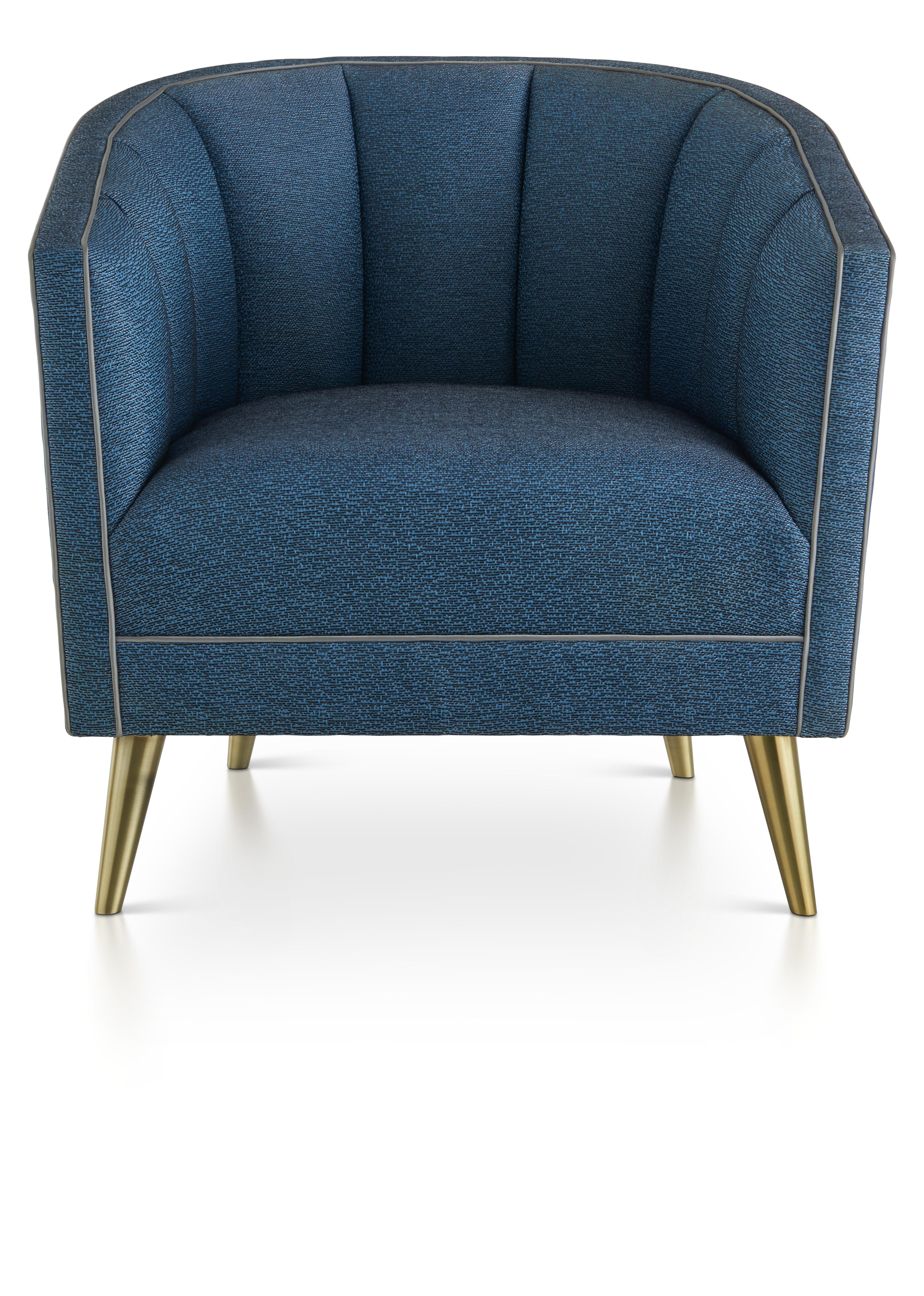 This elegant deep-seated armchair with scalloped back detail adds unique refinement to any room. 

The design can be upholstered in complementary fabrics, including a deep blue, with contrasting piping and finished with glistening fine brushed brass