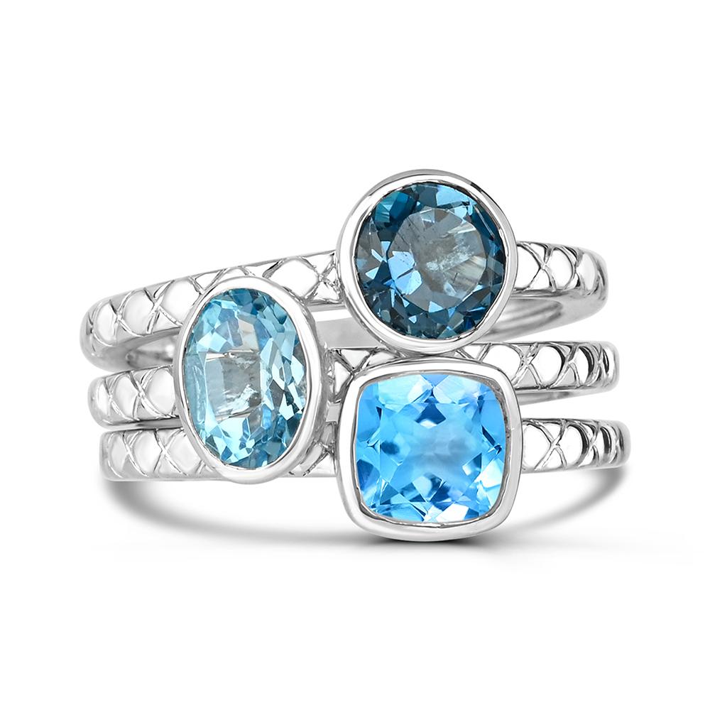 Indulge in the elegance of our Blue Hues Topaz Re-stackable Triple Ring Set in Sterling Silver. This ring set boasts a stunning combination of three bezel set solitaire ring with oval, round and cushion cut blue hues topaz.  The silver tone X