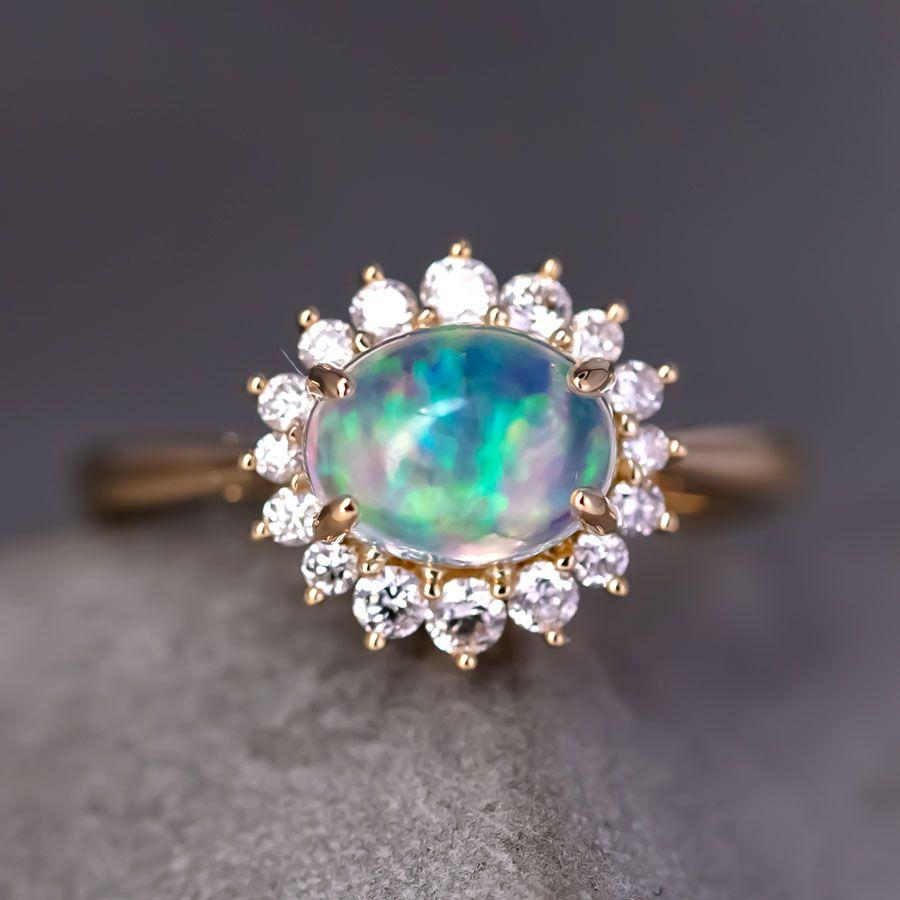 Blue-Ice Mexican Fire Opal Halo Diamond Engagement Ring 18K Yellow Gold.


Free Domestic USPS First Class Shipping! Free Gift Bag or Box with every order!

Opal—the queen of gemstones, is one of the most beautiful gemstones in the world. Every piece