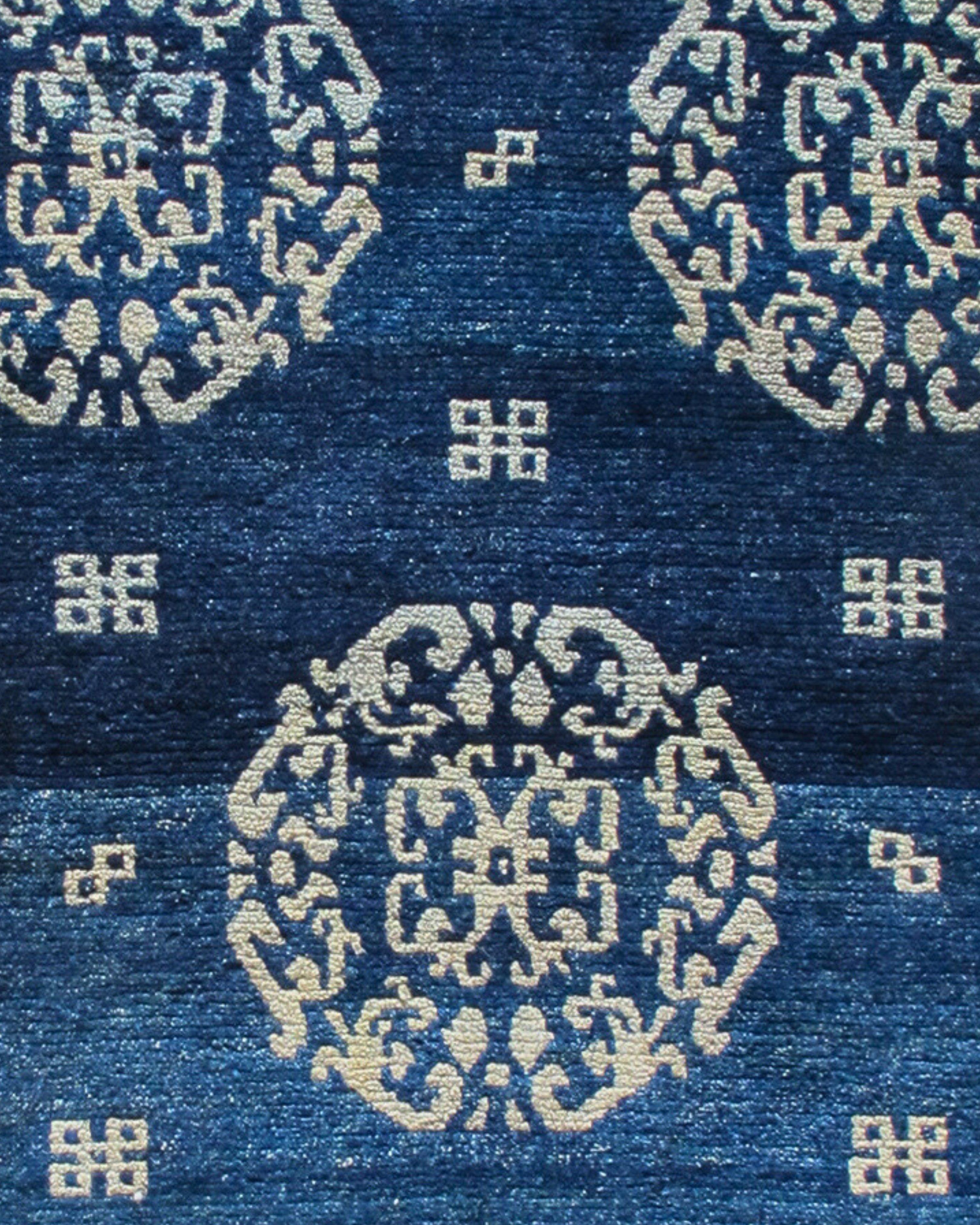Antique Blue-Indigo Tibetan Khaden Rug with Peonies, Late 19th Century

This evocative Tibetan khaden, or sleeping rug, draws large stylized peonies inspired by Chinese textile design of the Ming and Ching dynasties against a transplendent indigo