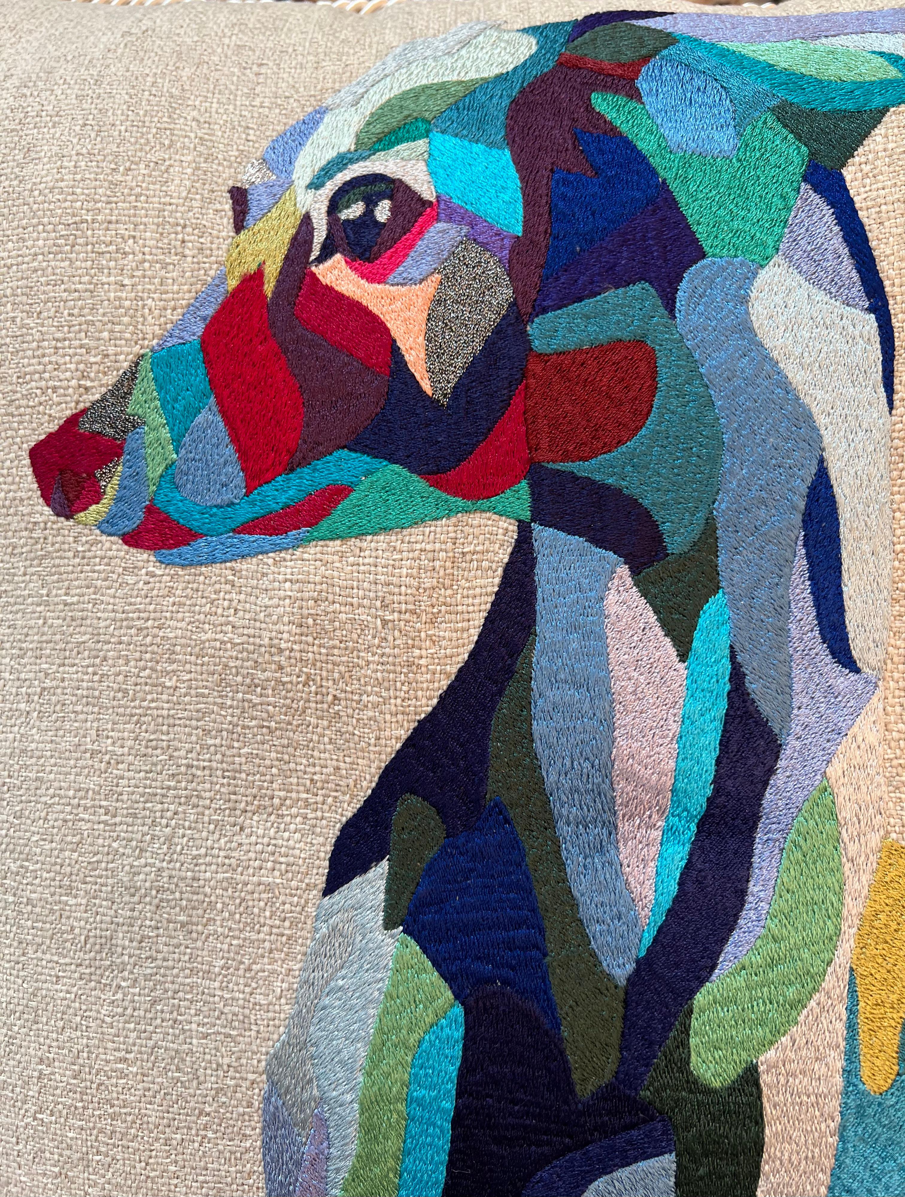 The Italian Greyhound dog, one of my favorite feline subjects, is finely embroidered with colorful silk threads: rich blue tones are assembled into a dynamic and edgy portrait on natural cotton fabric. A tonal twisted piping finishes the edges.