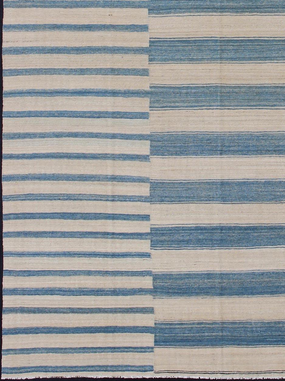 Modern flat-weave Kilim rug with stripes in shades of blue, gray, ivory, rug afg-6337, country of origin / type: Afghanistan / Kilim

This flat-woven kilim rug features a classic stripe design that places seamlessly in any modern interior. It's