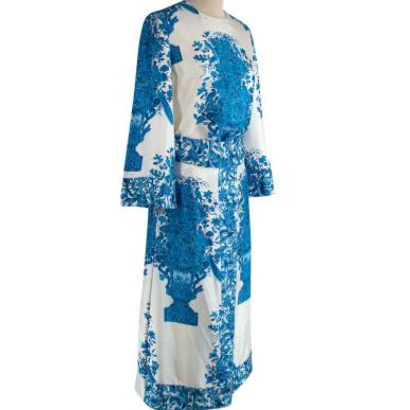 Valentino blue & ivory Delft print silk dress
 
 - Fluid silk twill midi dress, with a belted, defined waist
 - All over Delft-style print in tones of blue 
 - Round neck, flared sleeve
 - Concealed back zip
 
 Materials:
 Silk 
 
 Made in Italy 
 
