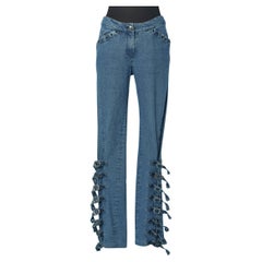 Blue jeans with silver metal buckle on the bottom Christian Dior