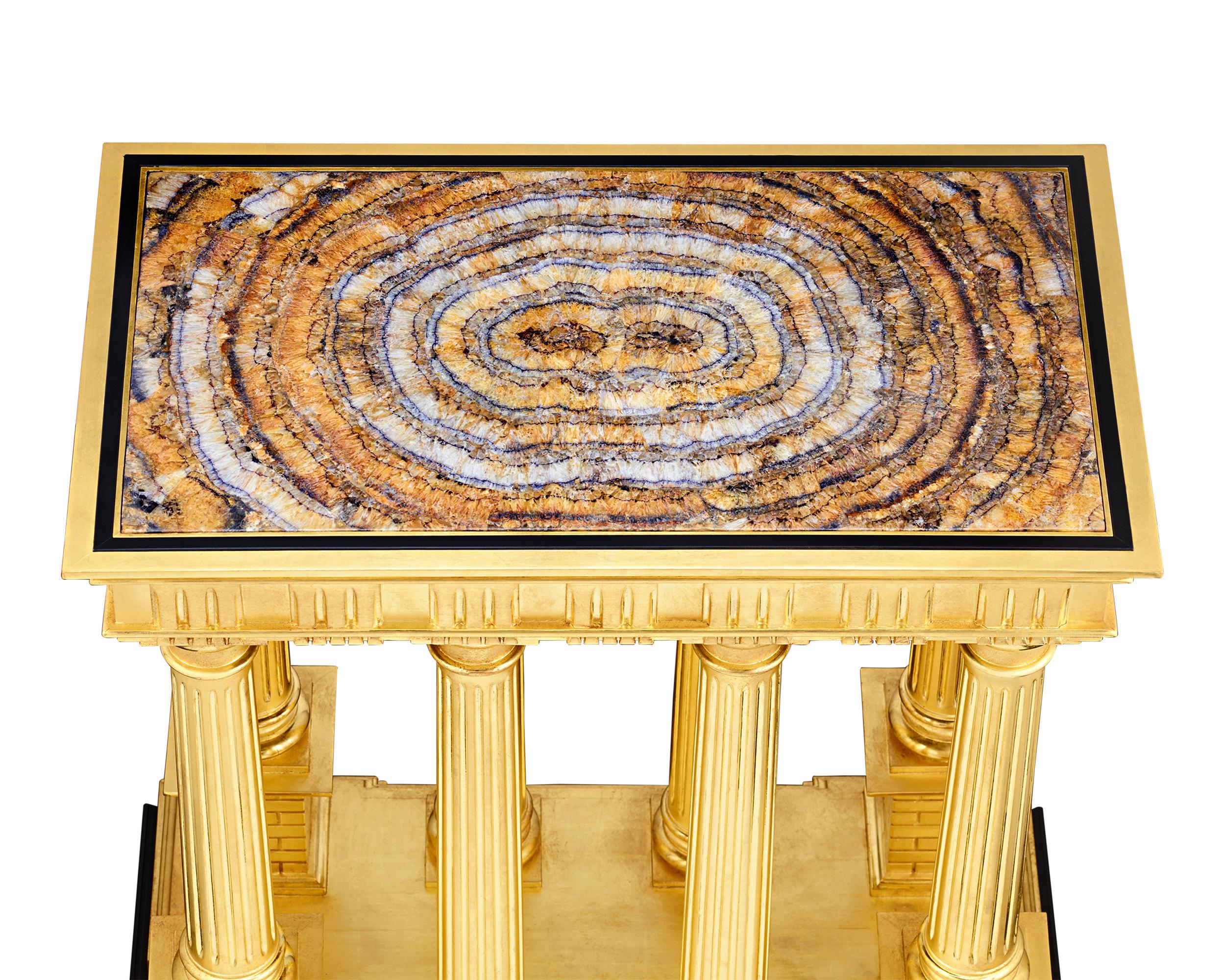 An especially fine and incredibly large example of rare Blue John is inset into the surface of this neoclassical giltwood table. The hardstone possesses all the best qualities of this rare semiprecious mineral, from its radiating crystalline