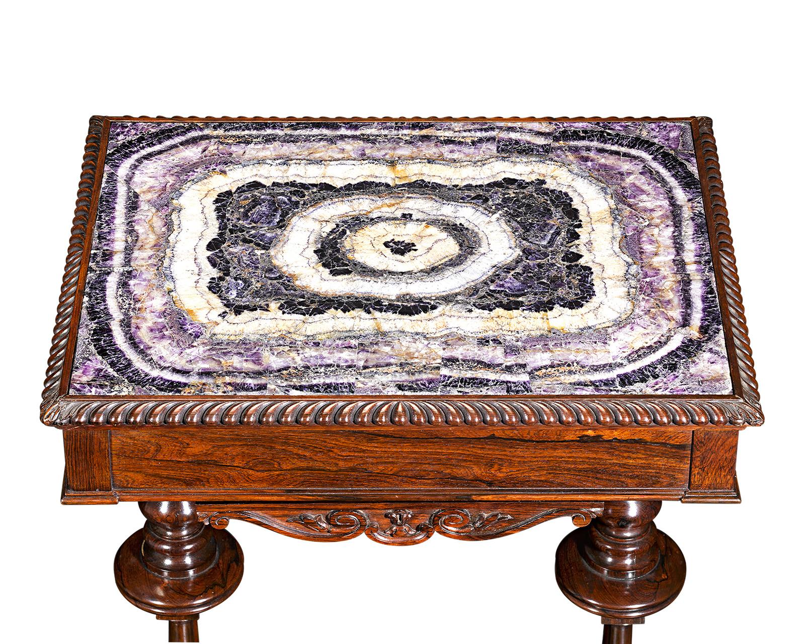 This one-of-a-kind table is among the most impressive pieces of Blue John furniture ever crafted. The star of the table is undoubtedly the monumental slab of Derbyshire Blue John that serves as the tabletop. The Blue John is not only monumental in