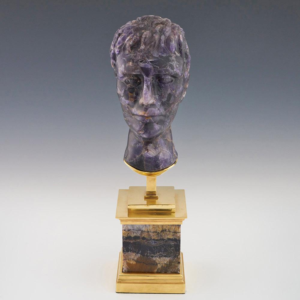 Heading : Blue John bust of a Roman Emperor with gilt metal and Blue John Stand
Date : 20th century
Origin : Most likely carved in Cornwall
Decoration : In the form of a Roman Emperor
Size :  Height 35.4cm. base 8.9cm x 8.9cm
Condition : Excellent –