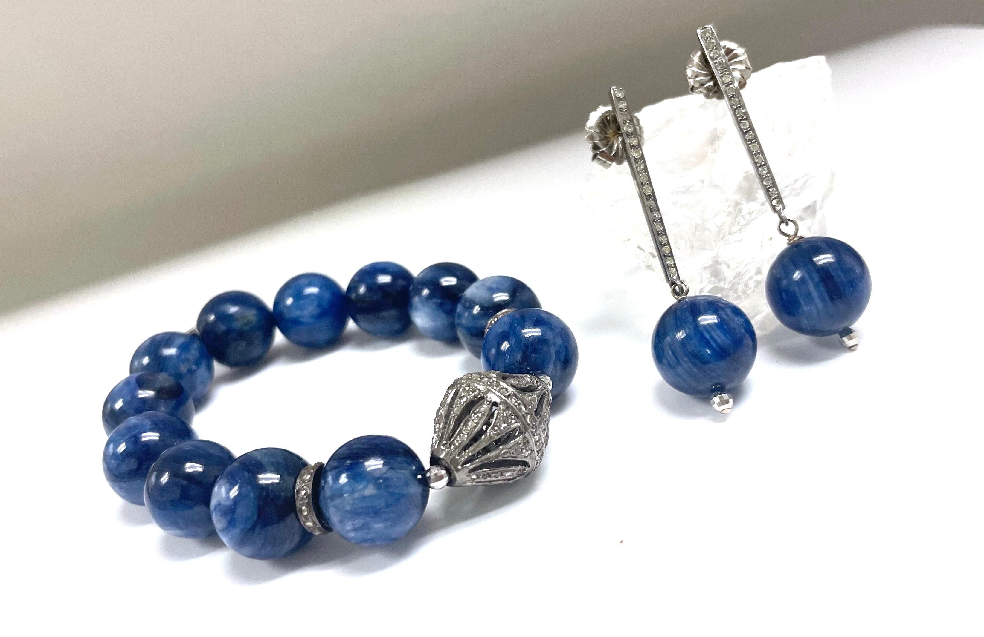 Description
Understated, yet elegant indigo blue color chatoyant Kyanite earrings. The beauty of the earrings is expressed in the details of the faceted ball and the tapered pave diamond bar/post. 
Item #E3071
Check out matching bracelet, Item#