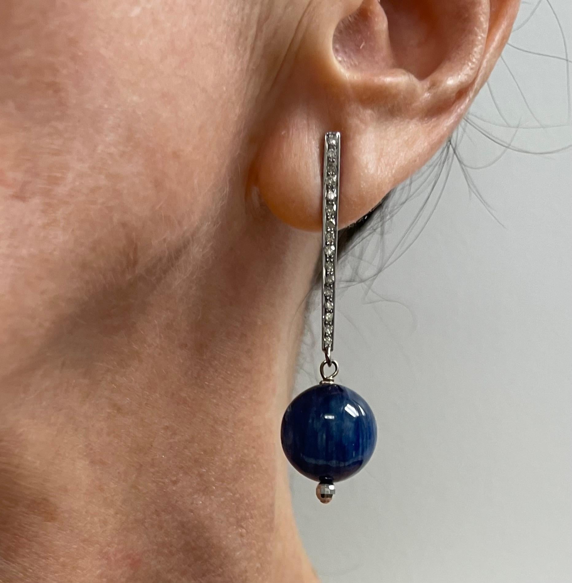 Description
Understated, yet elegant indigo blue color chatoyant Kyanite earrings. The beauty of the earrings is expressed in the details of the faceted ball and the tapered pave diamond bar/post. 
Item #E3071
Check out matching bracelet, Item#