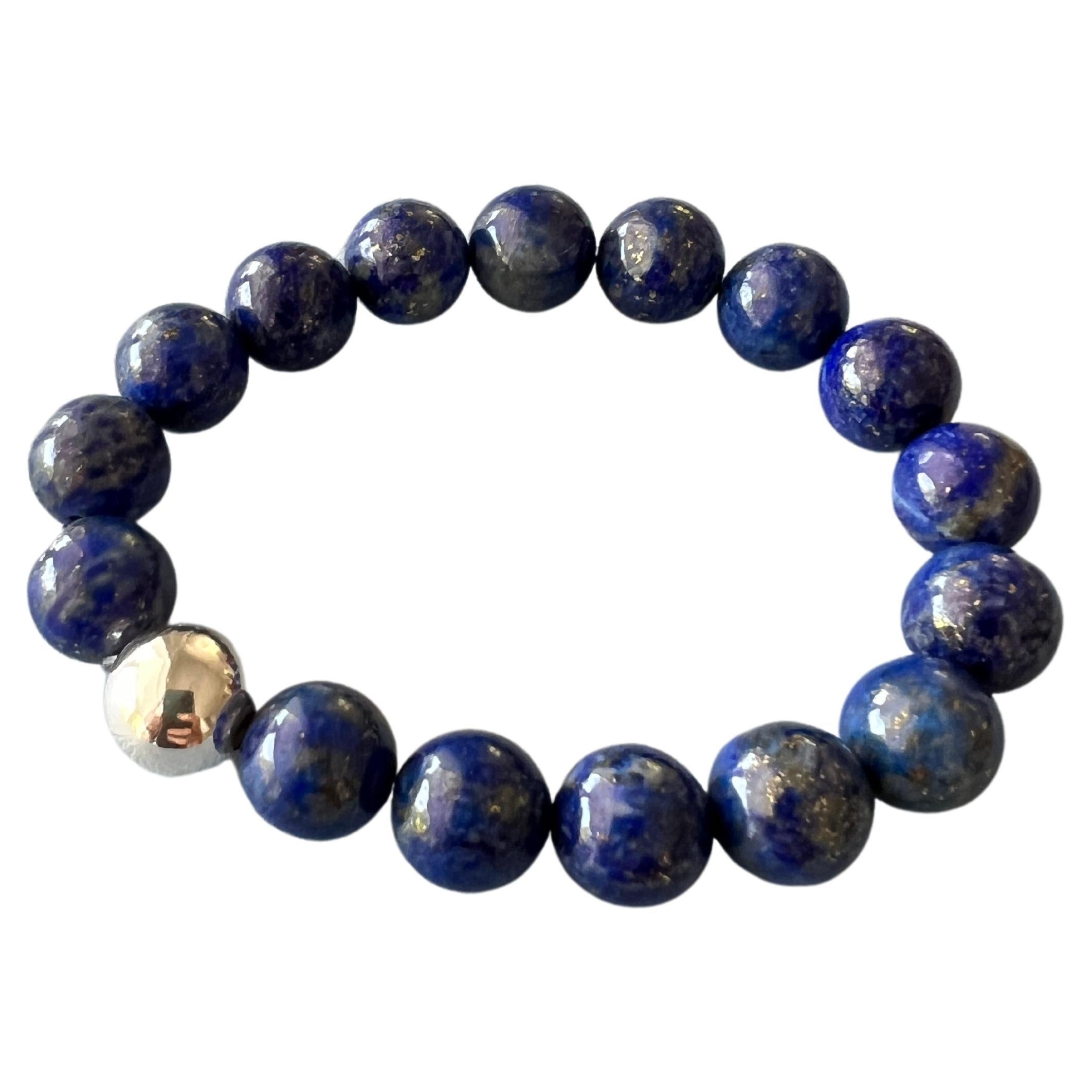 Blue Labradorite Round Bead Stackable Elastic Bracelet with Silver Bead 

Made in Los Angeles

Designer: J Dauphin

Labradorite was first discovered in Labrador, Canada in the late 18th century, Labradorite is recognized for its unique