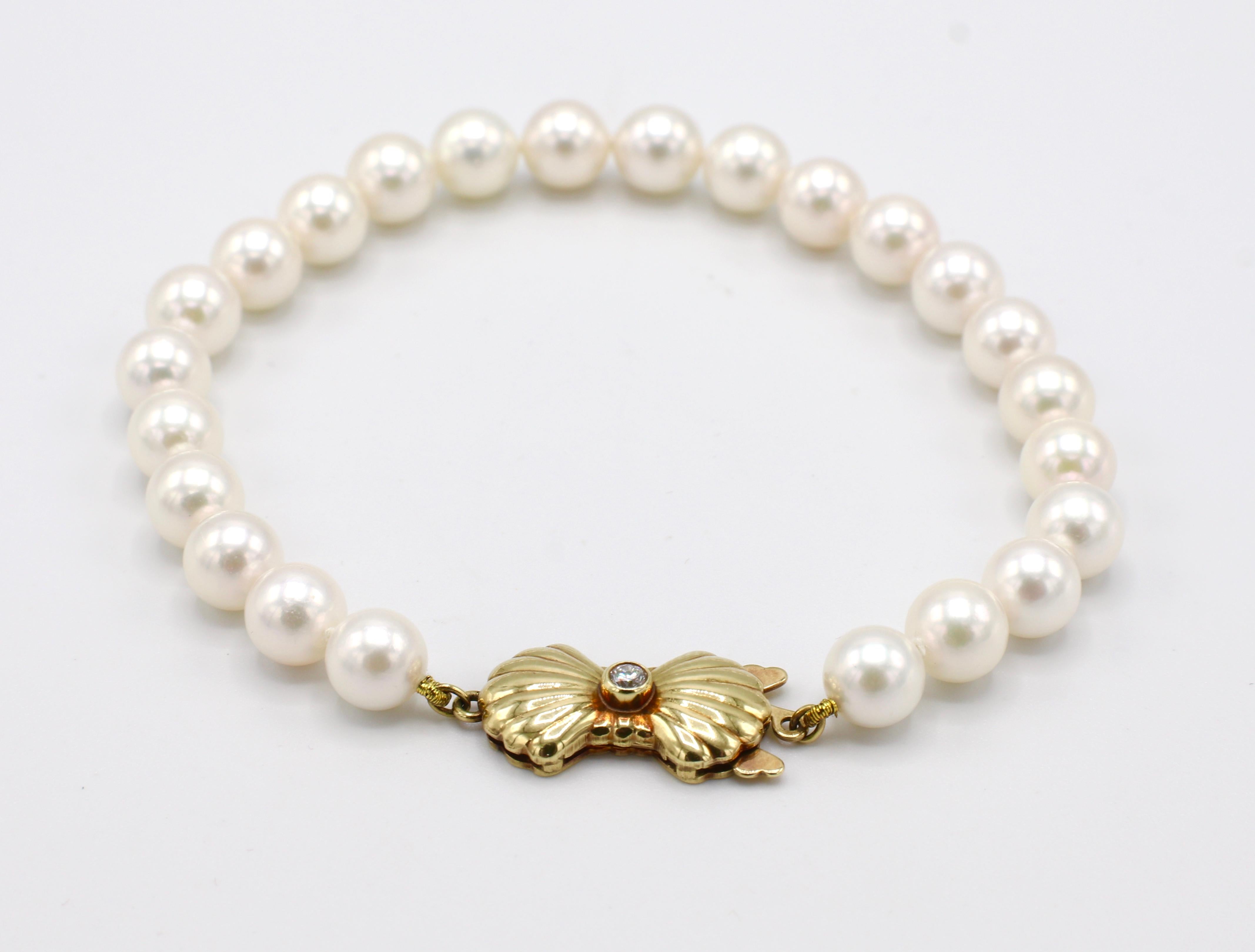 Blue Lagoon By Mikimoto Cultured Pearl & Diamond 14K Yellow Gold Clasp Bracelet 7 inches 

Metal: 14k yellow gold
Weight: 10.38 grams
Pearls: 6.1 - 6.5mm white creamy cultured pearls with high luster
Diamonds: 1 round brilliant cut diamond, approx.