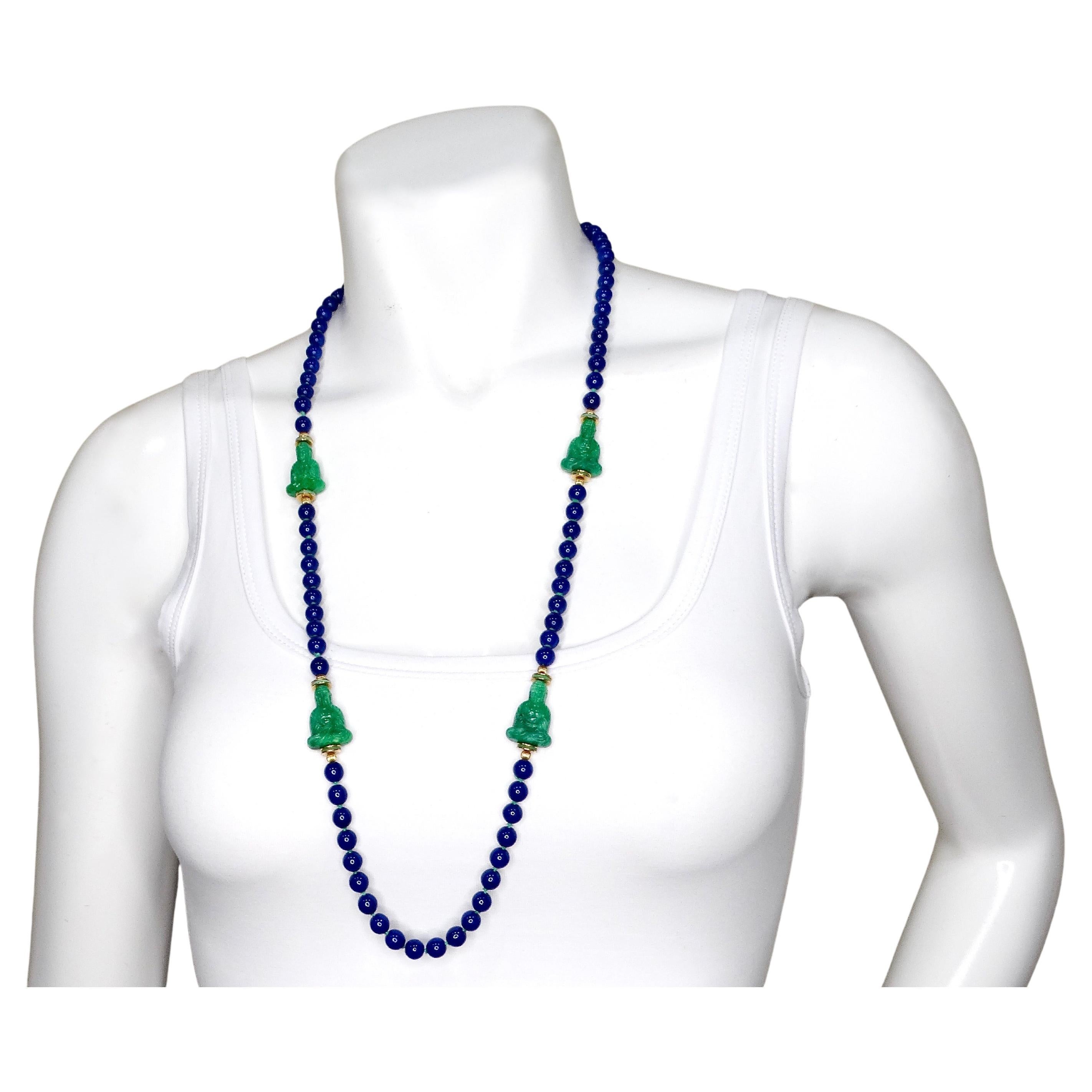 The Costume Blue Lapis & Jade Style Beaded Buddha Necklace is a striking accessory that combines vibrant colors and spiritual symbolism to create a versatile statement piece. The necklace features synthetic blue lapis-style beads that evoke the