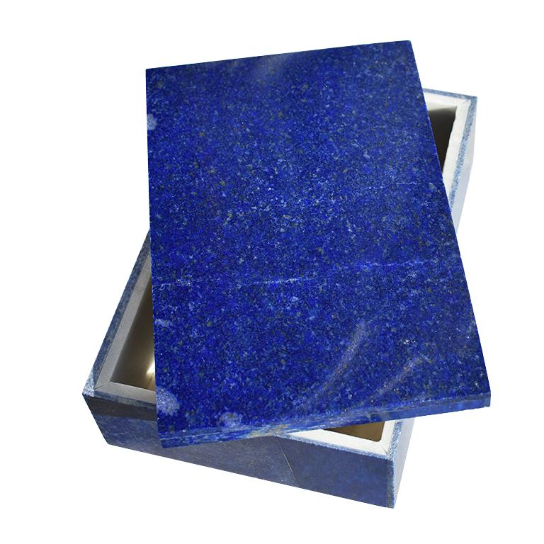 Beautiful blue Lapis Lazuli and Carrara marble stone jewelry box. Created from genuine blue Lapis Lazuli, this box is low in profile and rectangular in form. This lovely jewelry or trinket box features a lid that fits onto its base. Both of which