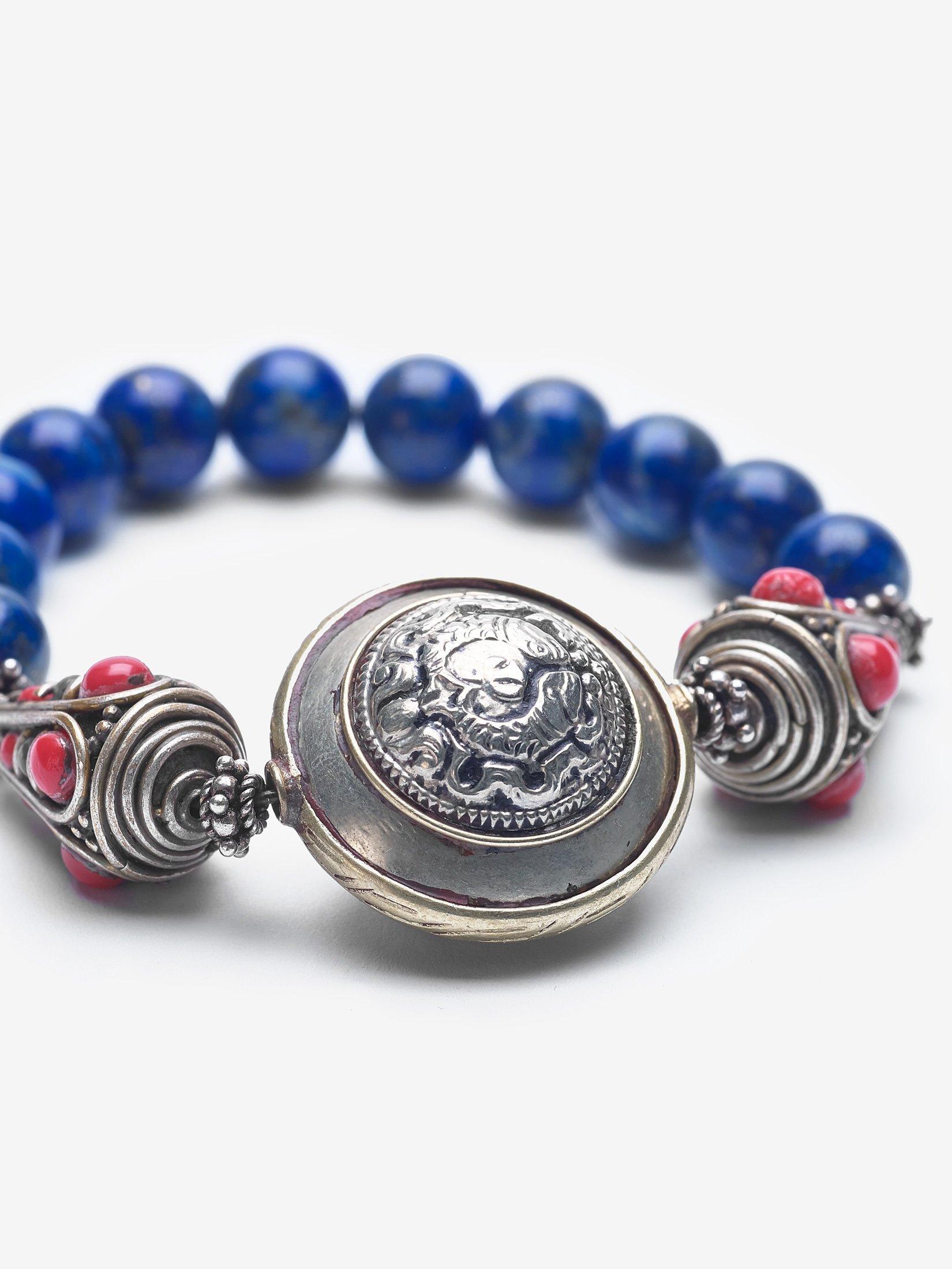 Lapis is a deep celestial blue and has long represented truth and wisdom along with invoking good judgment and wisdom. The shield represents protection. It is adorned with Nepalese Beads.

Materials
Lapis, Nepalese Beads, Sterling Silver, White