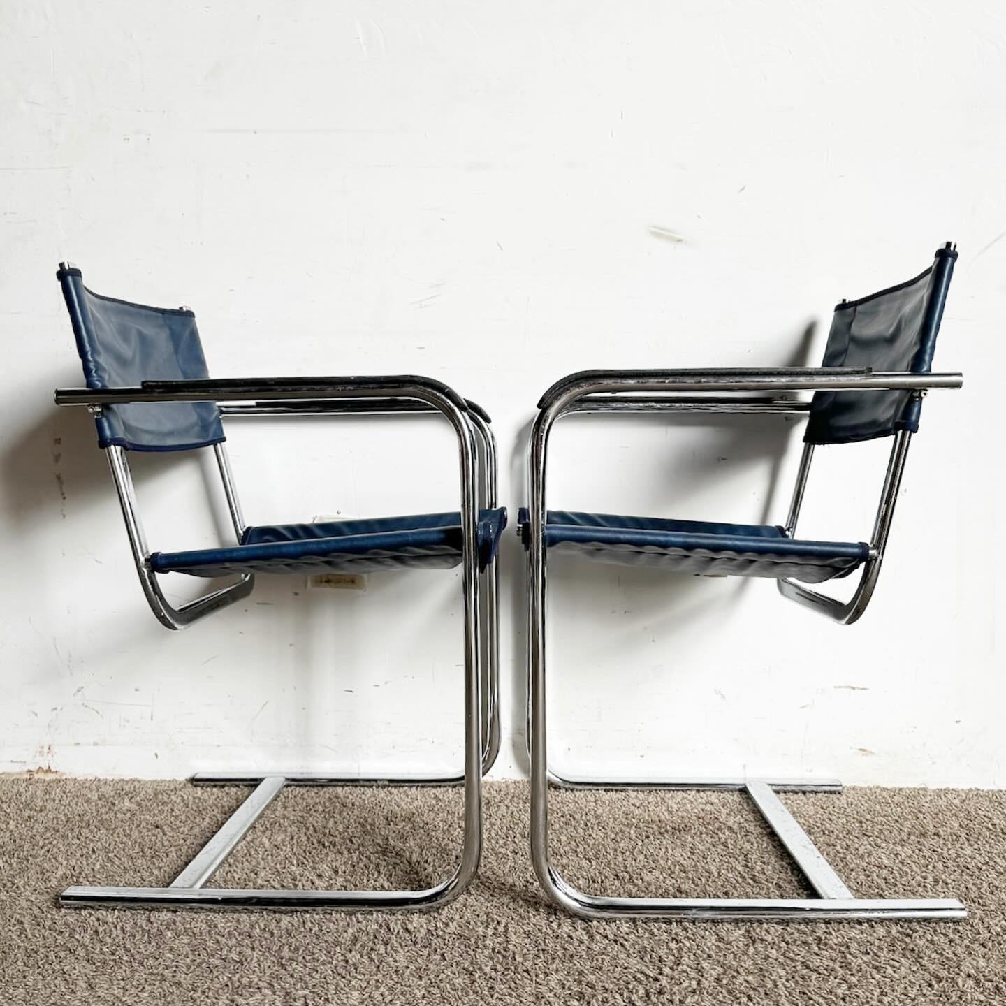 Elevate your dining area with the Blue Leather Chrome Cantilever Dining Arm Chairs. These modern chairs blend blue leather with chrome frames for a sophisticated look, ideal for stylish homes.
Some wear to the leather and pitting as seen in the