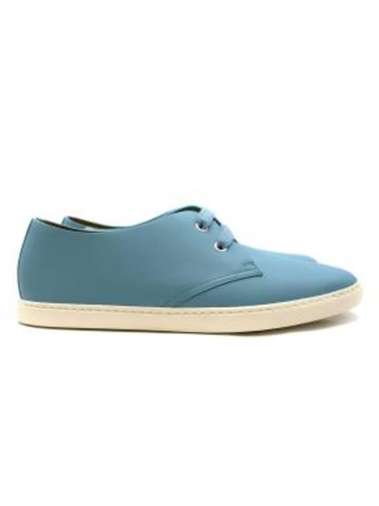 Hermes Blue Leather Pumps
 
 - Sky blue leather plimsole style pumps with white rubber soles and embossed branding around the ankle 
 - White eyelets and light blue lace up fronts
 - Rubber logo patch on the inner sides of the shoes
 - Tonal