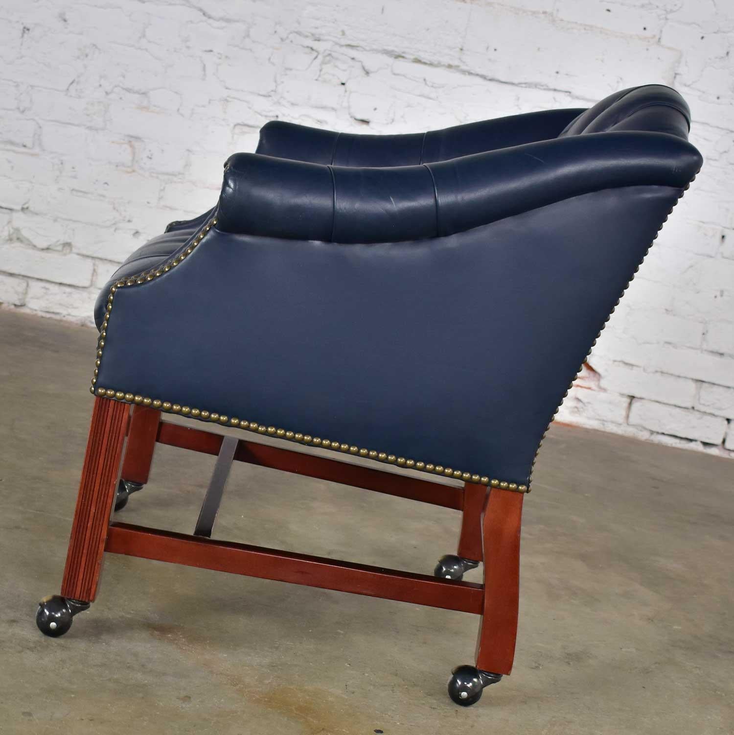 20th Century Blue Leather Rolling Captain’s Chair Campaign Chippendale Style