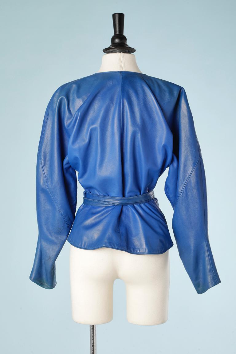 Blue leather wrap jacket with feathers embroideries in silk threads and passementerie. Raglan sleeves 
SIZE S