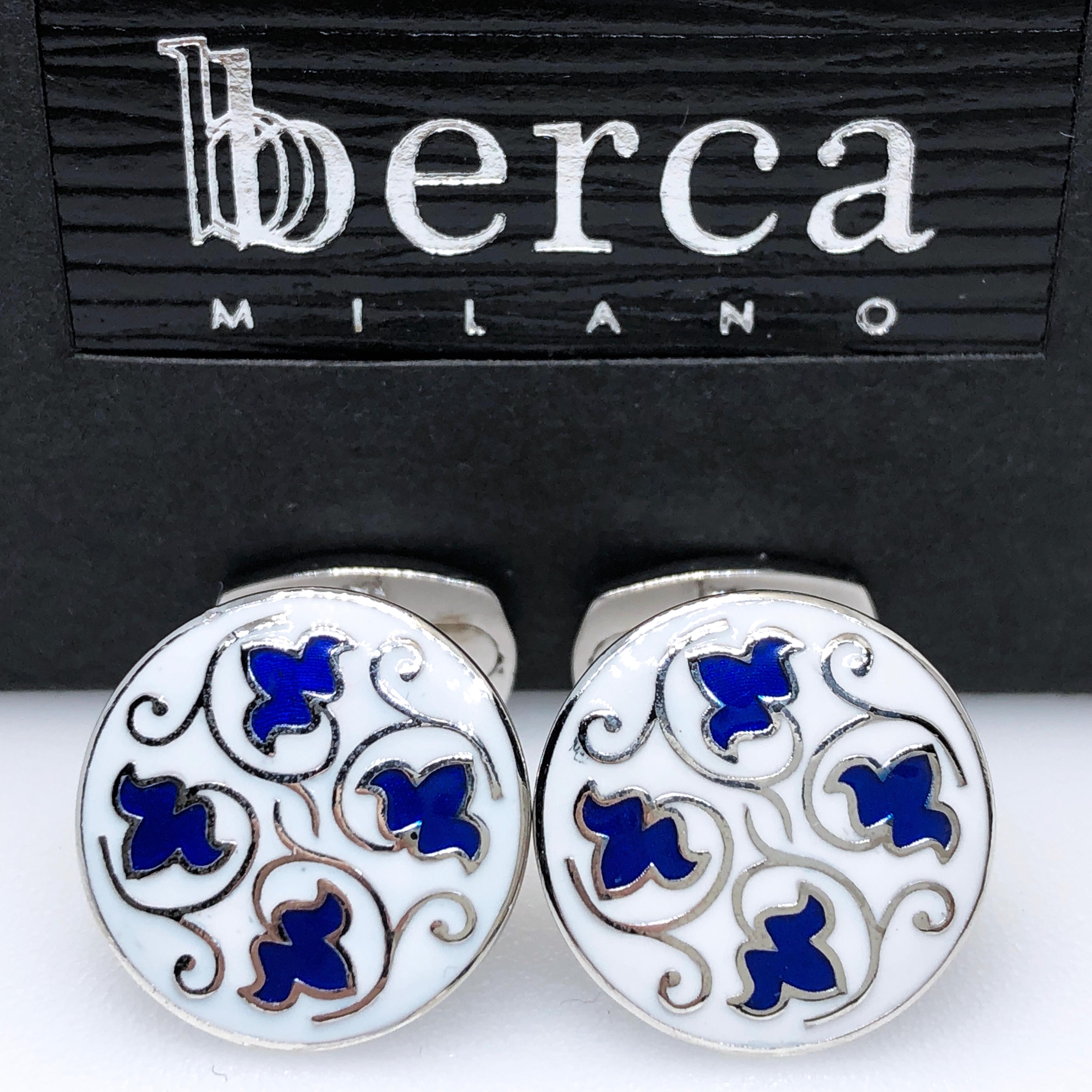 Chic, Unique yet Timeless Hand Enameled Blue Grape Leaves, Symbol of Good Luck, in a Round White Setting Sterling Silver Cufflinks, T-bar back.
In our Smart Suede Tobacco Leather Case and Pouch.

Front Diameter about 0.679 inches.