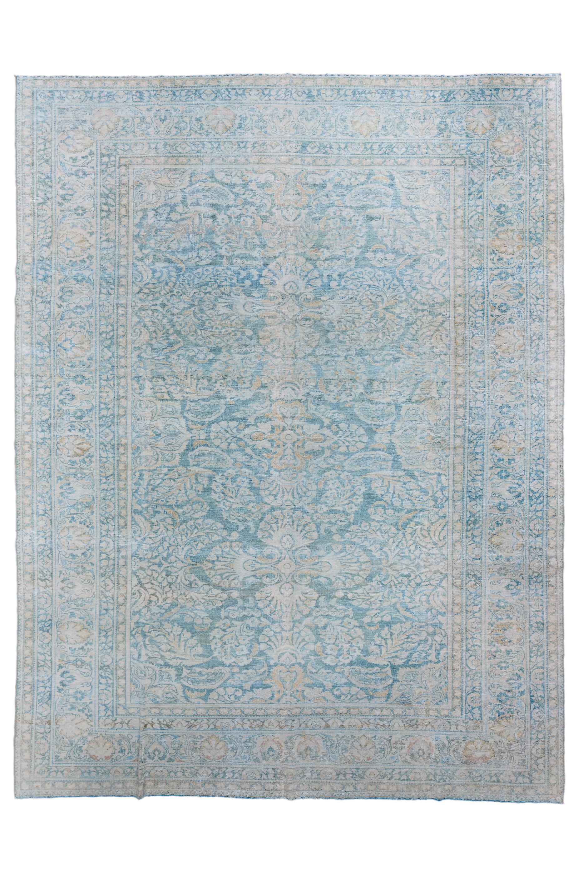 This village piece shows a clear influence of the “American Sarouk” style, with detached, complex curvilinear floral sprays on a dark blue field. Ecru main border with oval upright petal palmettes and spacer floral sprays. Medium weave on cotton.