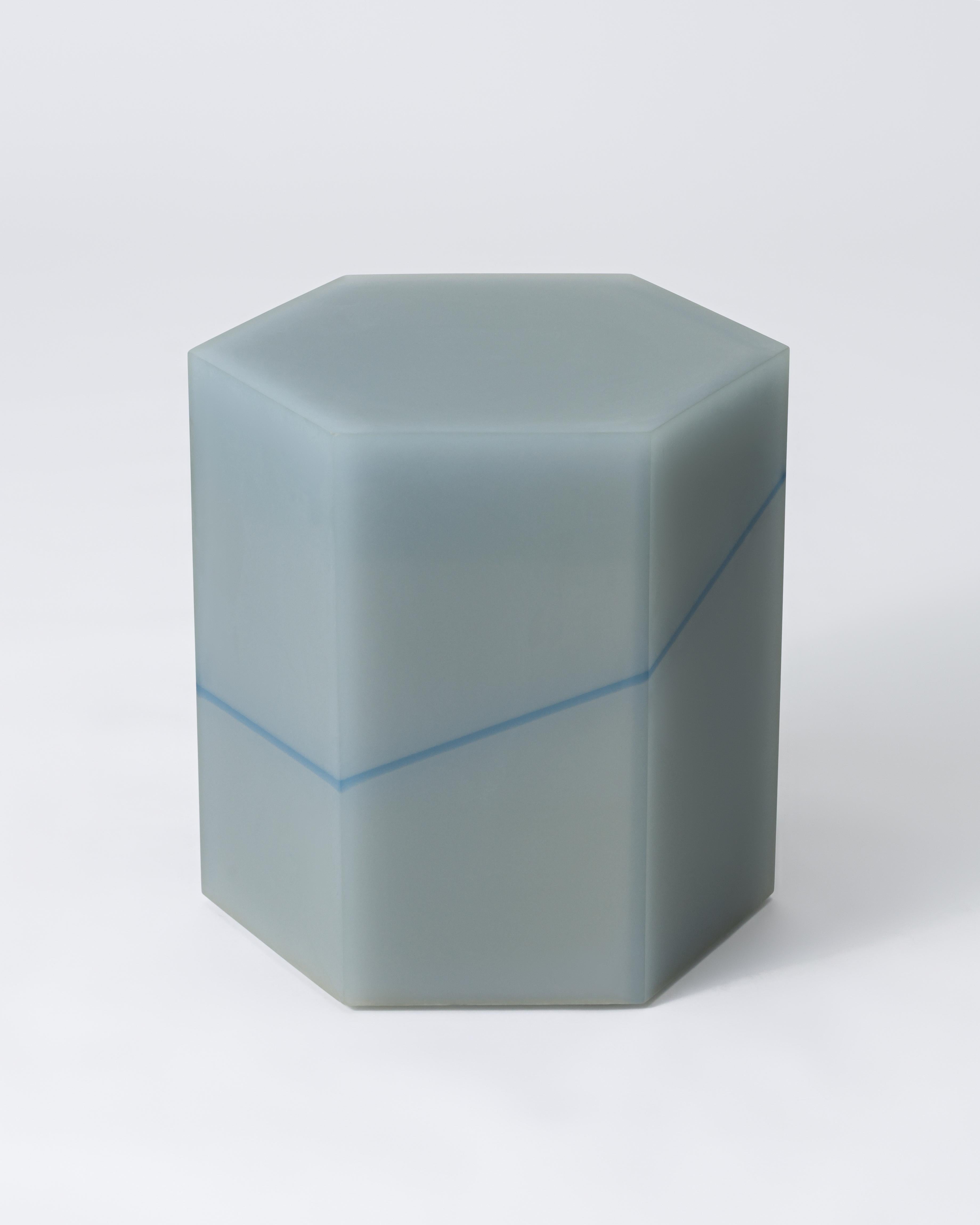 This ombre resin side table by Facture Studio goes beyond a simple accent piece to make a commanding statement. Hexagonal in shape, it is meticulously crafted from five layers of ascending color saturation, gradually shifting from dark to light in a