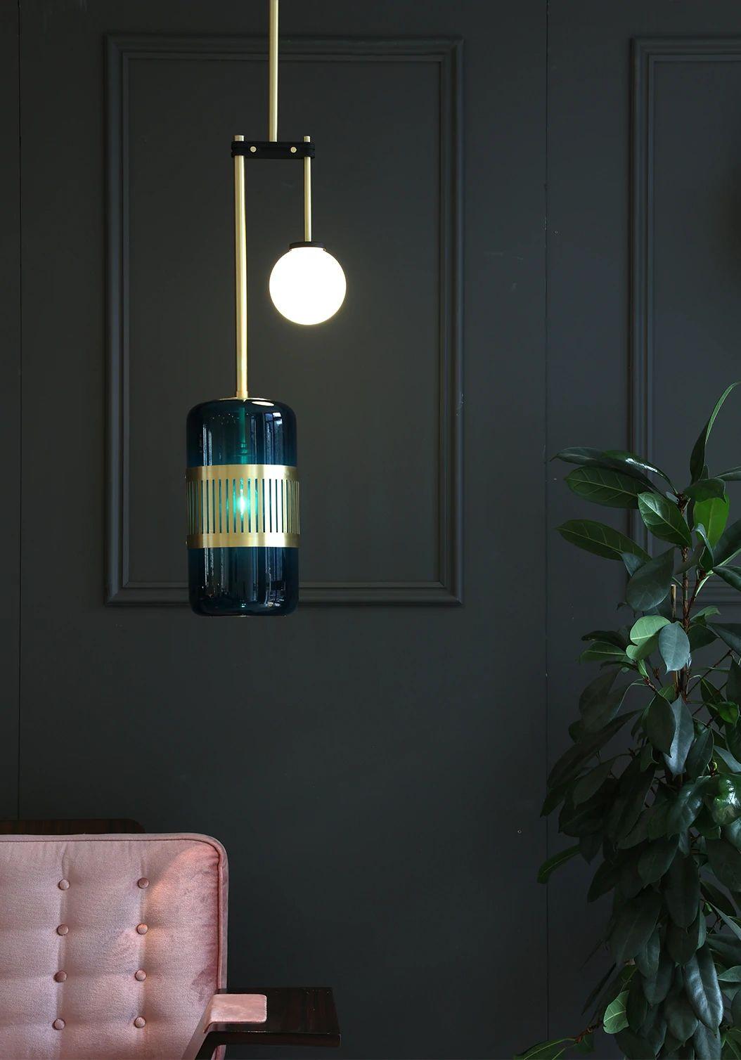 Blue Lizak drop pendant by Bert Frank
Dimensions: D 78 x W 27 x H 78 cm
Materials: Brass and glass

Available finishes: Brass, opal and blue
All our lamps can be wired according to each country. If sold to the USA it will be wired for the USA