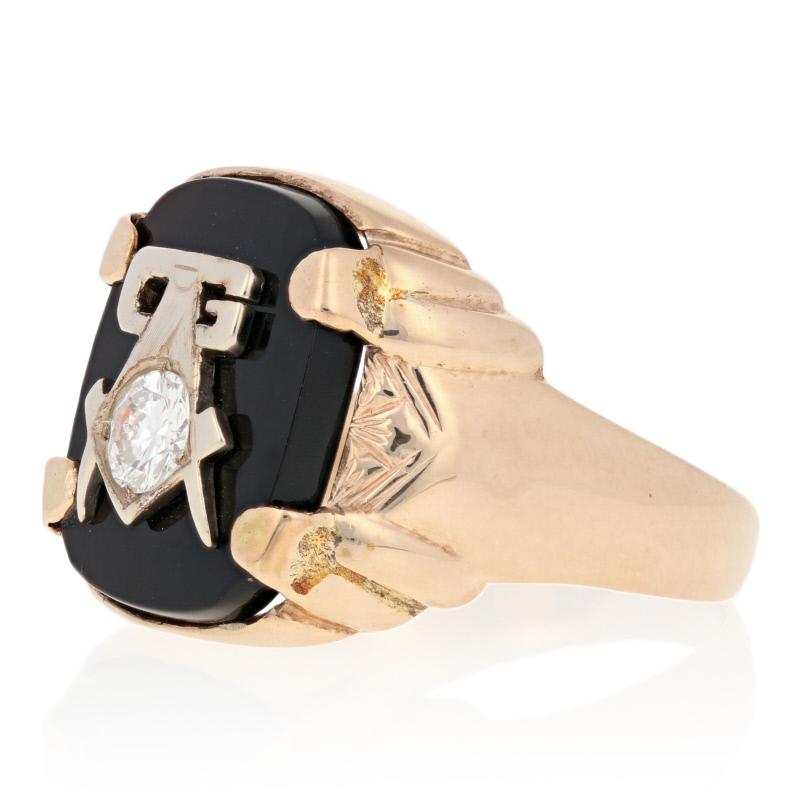 This handsome vintage ring would make a great gift for a Blue Lodge Master Mason. Crafted in sturdy 10k yellow gold, the signet-style ring features a genuine onyx topped with the iconic Blue Lodge square and compass and the letter G in white gold.