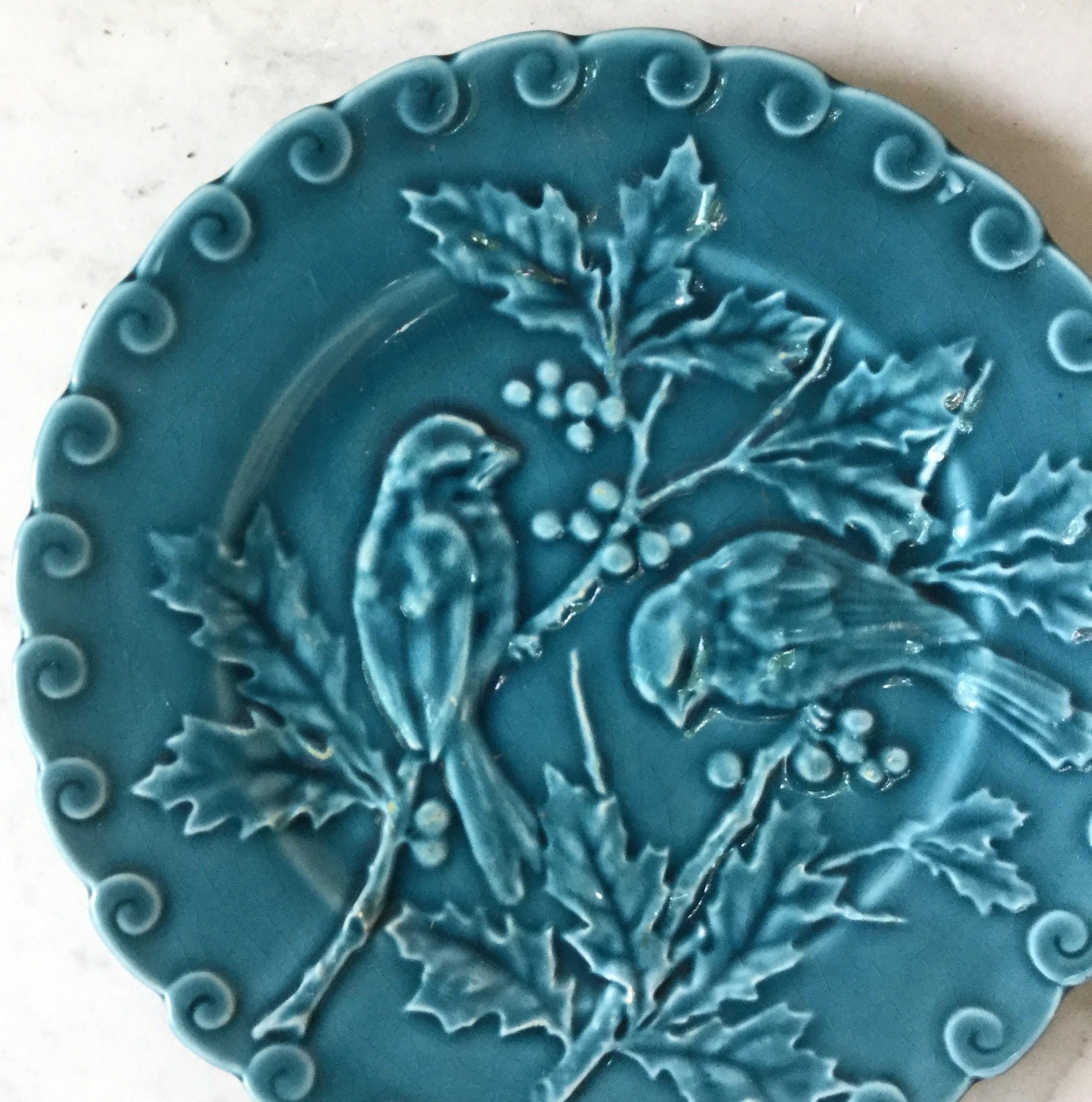 Charming blue majolica plate with birds and holly Sarreguemines, circa 1880.