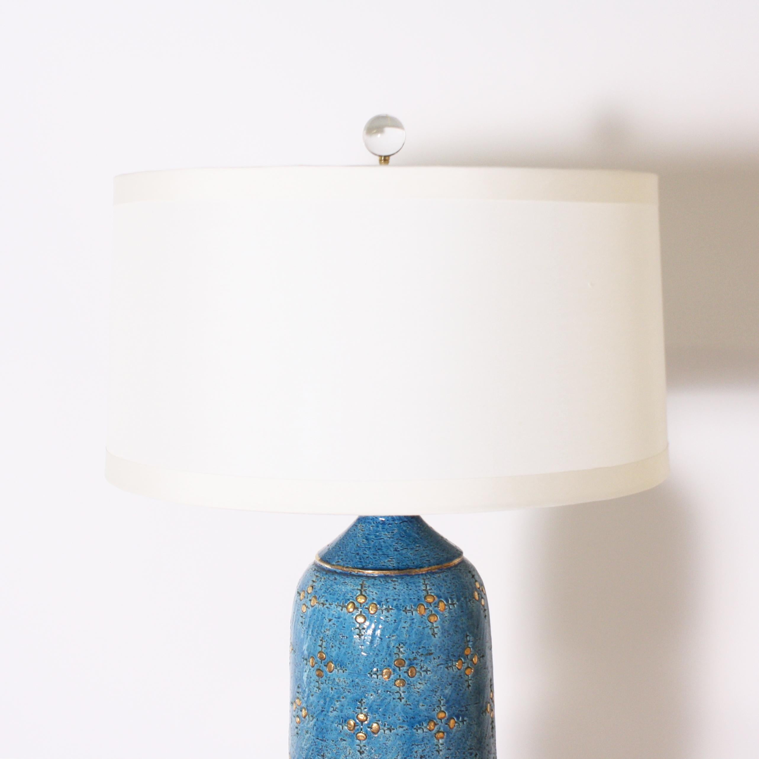 Blue Marbro ceramic lamp, circa 1960

Off-white pongee shade, crystal ball finial, Lucite base with gold twisted cording.
