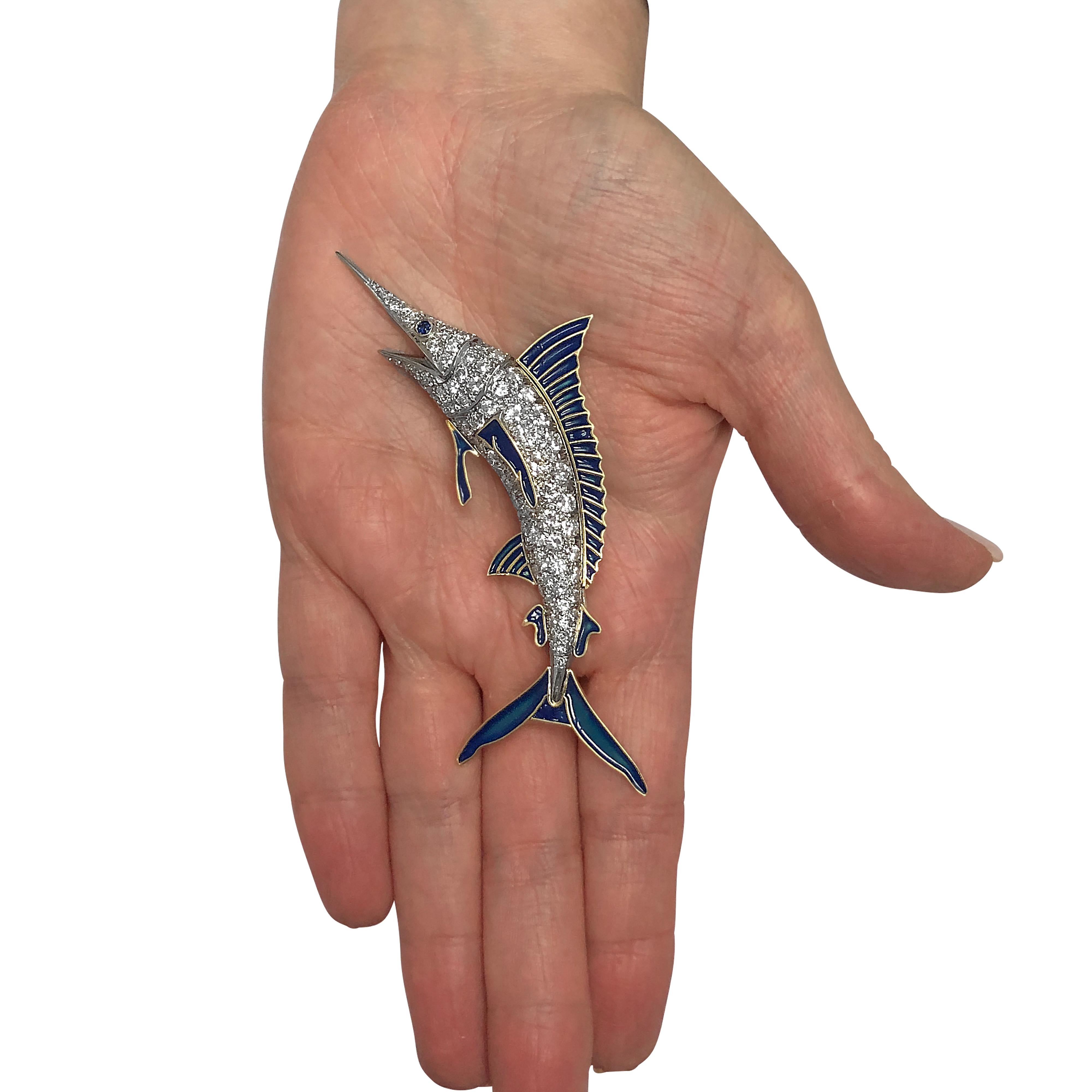Delight in the catch of the day with this spectacular Blue Marlin brooch pin. Crafted in platinum with 18 karat yellow gold and blue enamel detail, this Blue Marlin is encrusted with round brilliant cut diamonds weighing approximately 11 carats