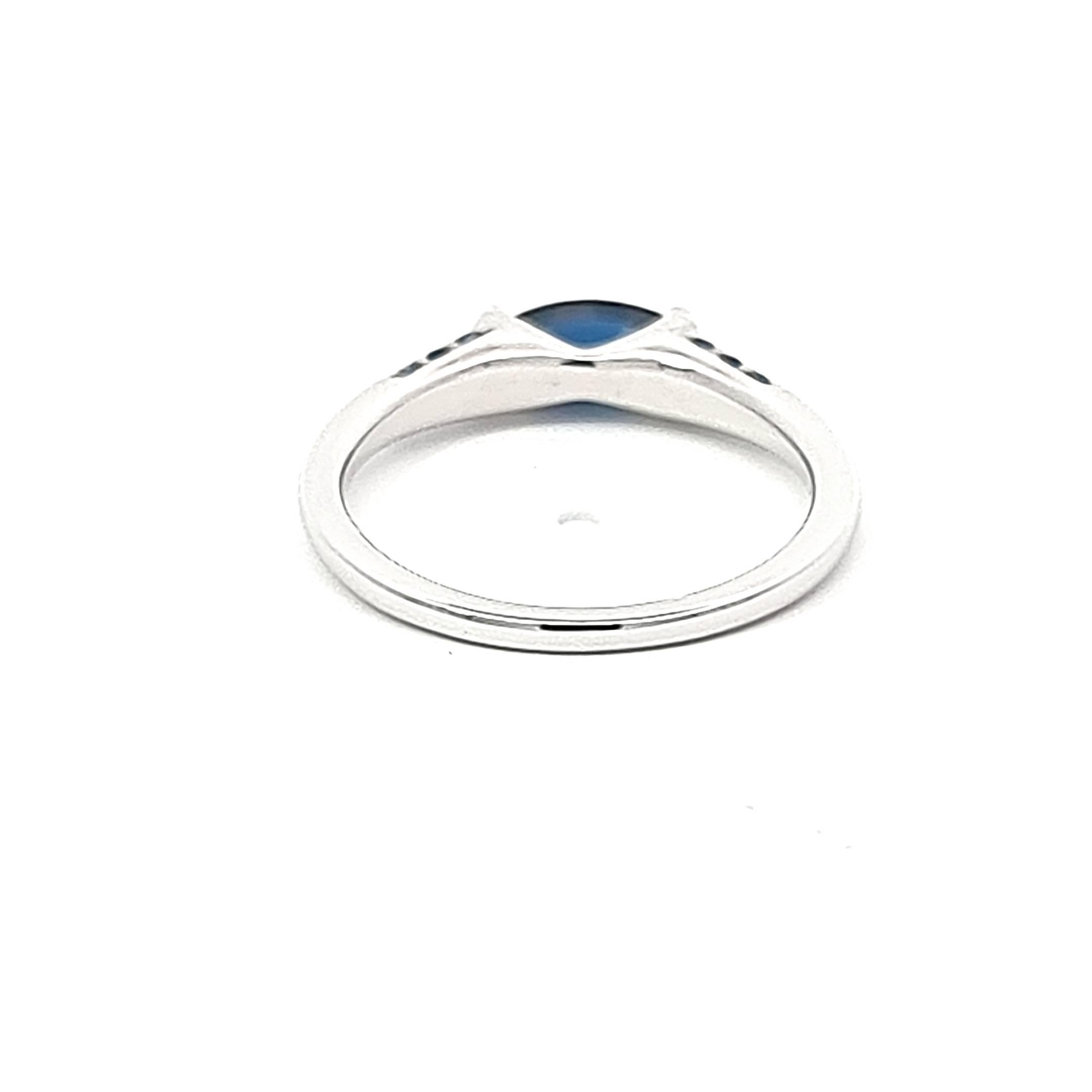 Marquise Cut Blue Marquise Sapphire and Blue Round Sapphires in a White Gold Ring For Sale