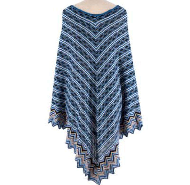 Missoni Blue Metallic Woven Fringed Poncho
 
 -Striped blue and black fine knit
 - Large bateau neckline 
 - Zigzag hemline 
 
 Materials:
 This item does not have a care label, but we believe it to be a viscose knit blend
 
 Made in Italy 
 
